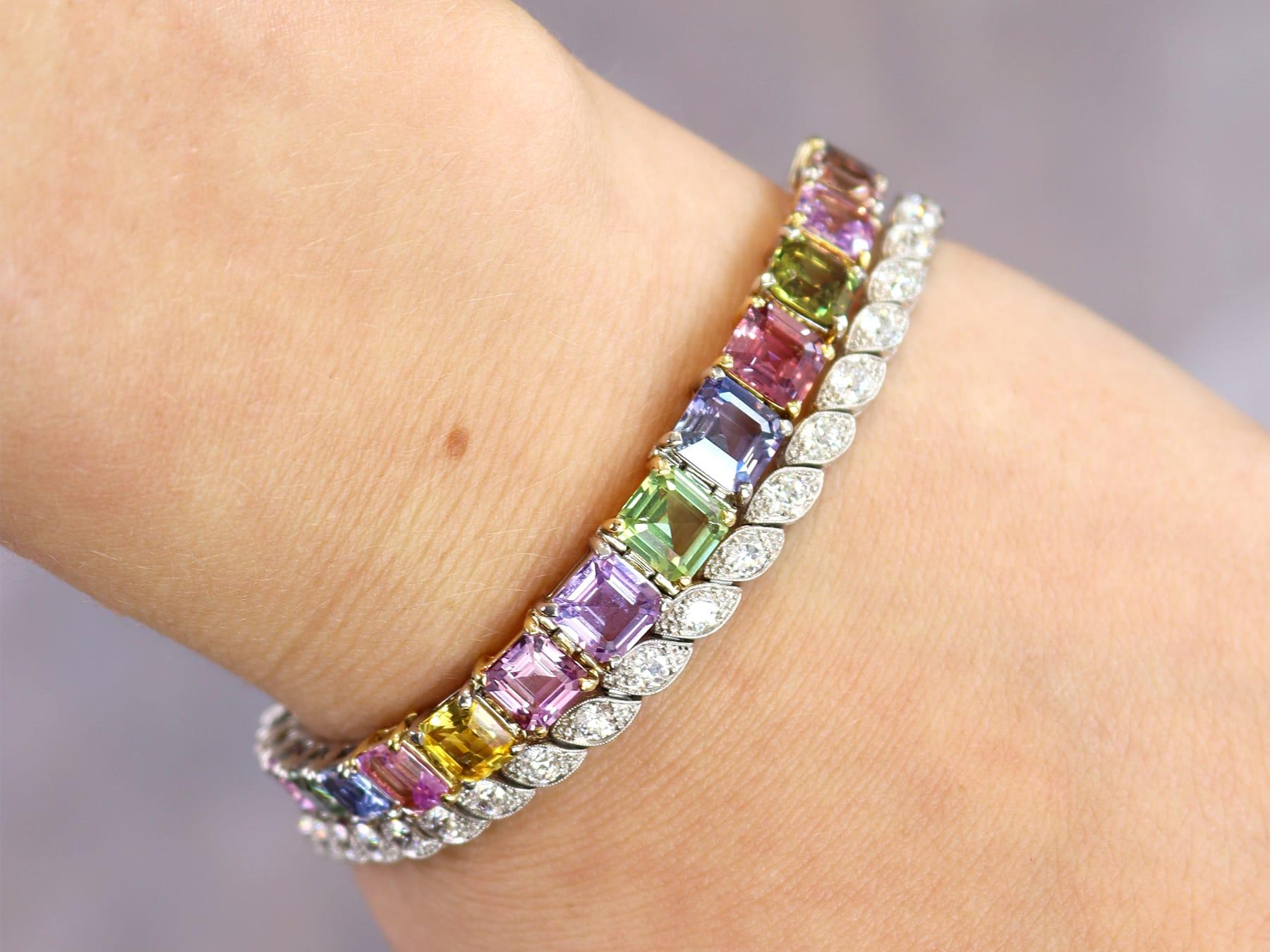 A stunning, fine and impressive contemporary 26.81 carat multi-colored sapphire, platinum and 14 karat yellow gold bracelet; part of our diverse collection of gemstone bracelets.

This fine and impressive sapphire bracelet has been crafted in