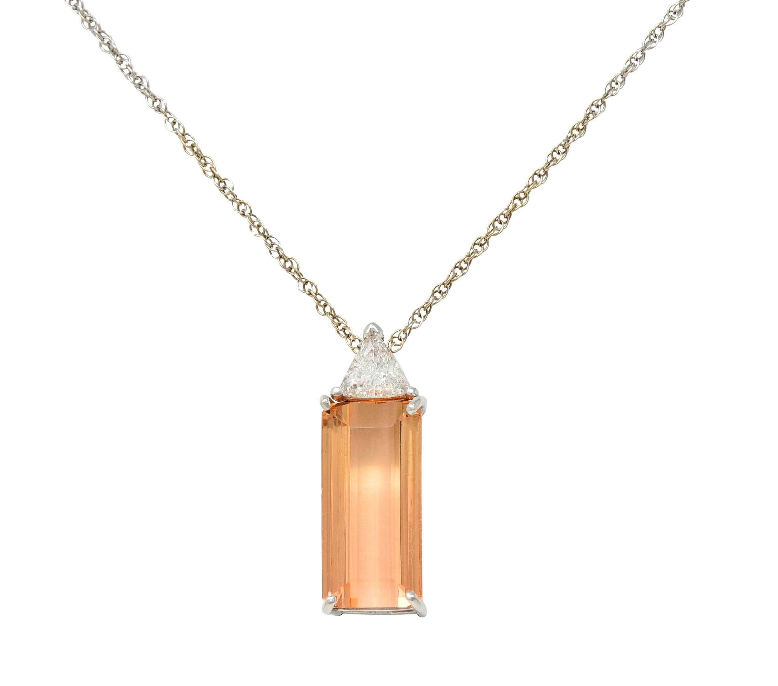 Comprised of a 1.5 mm white gold rope chain suspending a platinum pendant
Featuring a mixed emerald cut topaz weighing approximately 2.33 carats
Transparent light pinkish orange Imperial in color - prong set in basket
Accented by a trilliant cut