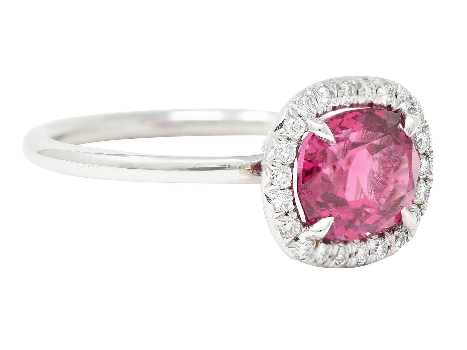 Featuring a cushion mixed cut spinel weighing approximately 2.60 carats

Transparent with saturated purplish pink color

Talon set and surrounded by a round brilliant cut diamond halo

Weighing in total approximately 0.25 carat - eye clean and