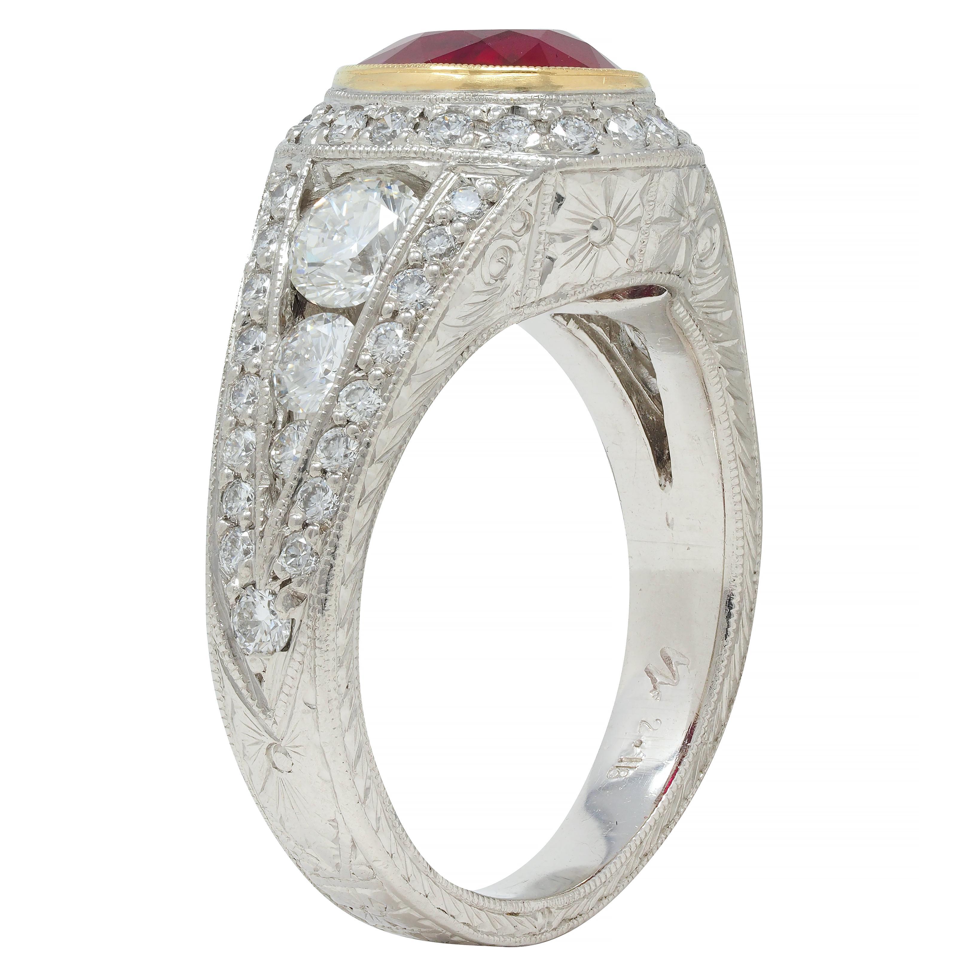 Centering an oval cut ruby weighing 1.92 carats - transparent vivid red in color 
Natural Burmese in origin with minor indications of treatment residue 
Bezel set in yellow gold with a halo surround of round brilliant cut diamonds
With additional
