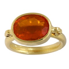 Contemporary 3.30 carat fire opal 18k yellow gold bezel ring