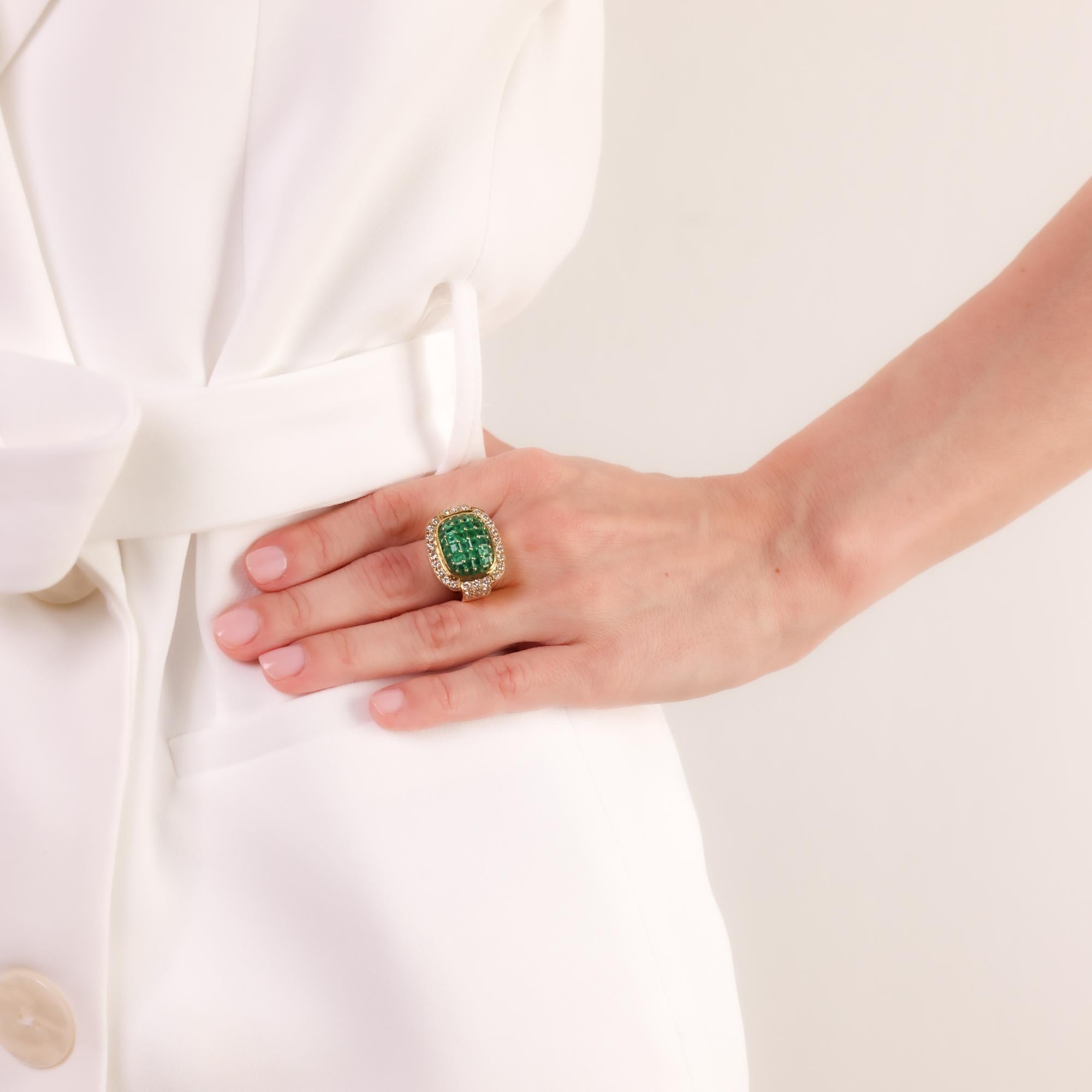 A striking contemporary ring set with 3.50 carats of vivid emeralds and 1.10 carats of brilliant diamonds, beautifully crafted in rich 18k yellow gold.

Center stone: 48 carré and calibre cut emeralds 
Weight: Approximately 3.50 carats
Accent stone: