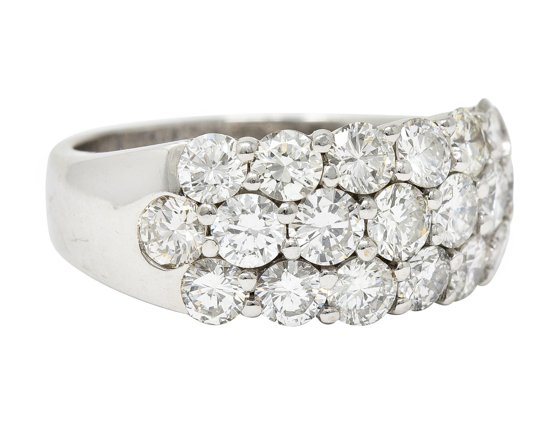 Wide band ring is pavè set to front with round brilliant cut diamonds. Weighing in total approximately 3.50 carats - G/H color with overall VS2 clarity. Stamped 18K for 18 karat gold. Circa 21st century. Ring Size: 7 3/4 & sizable. Measures: North