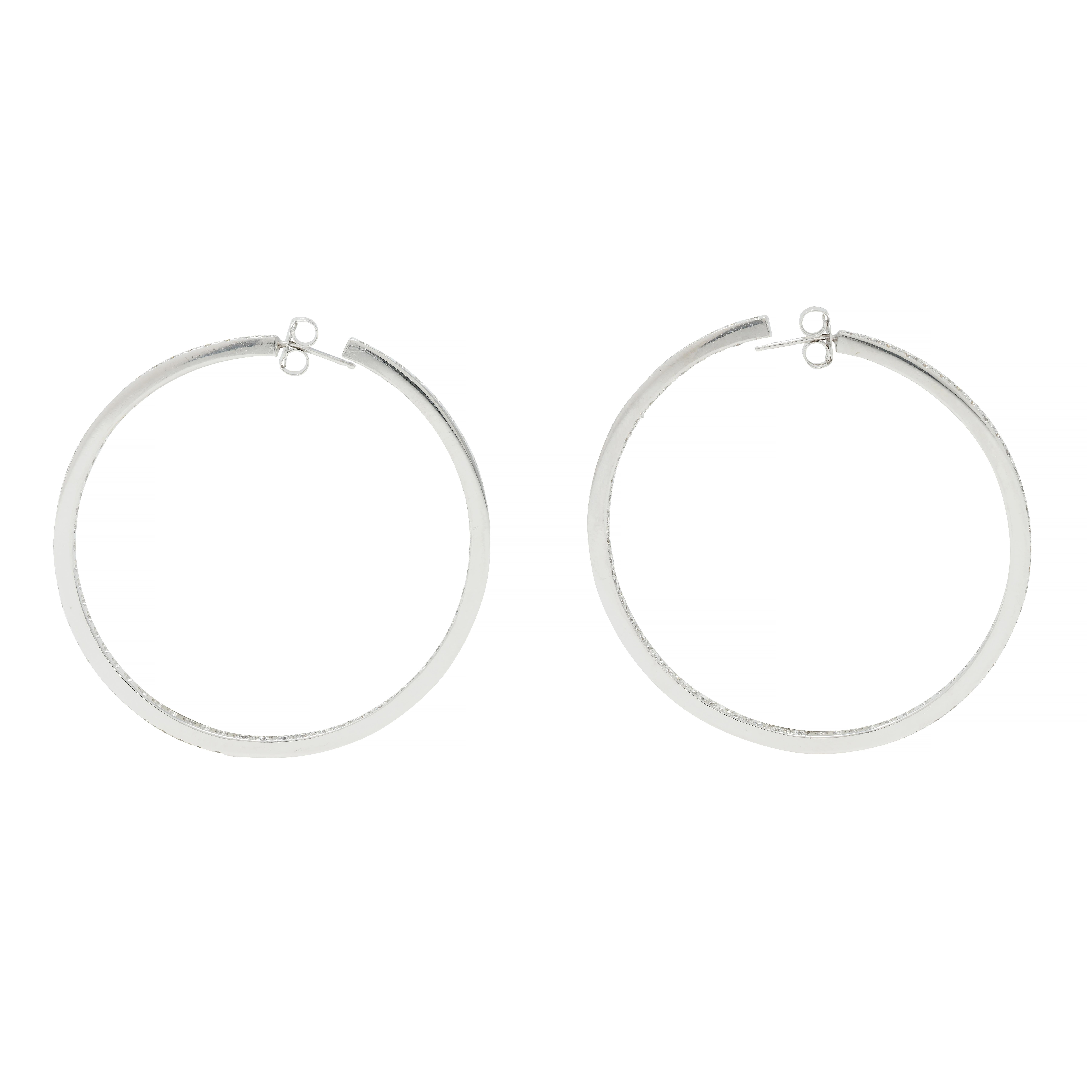 Designed as round white gold open hoops with round brilliant cut diamonds
Bead set inside-outside style with an interior row and exterior row 
Weighing approximately 3.60 carats total 
G/H color with VS2 clarity
With high polish edges
Completed by