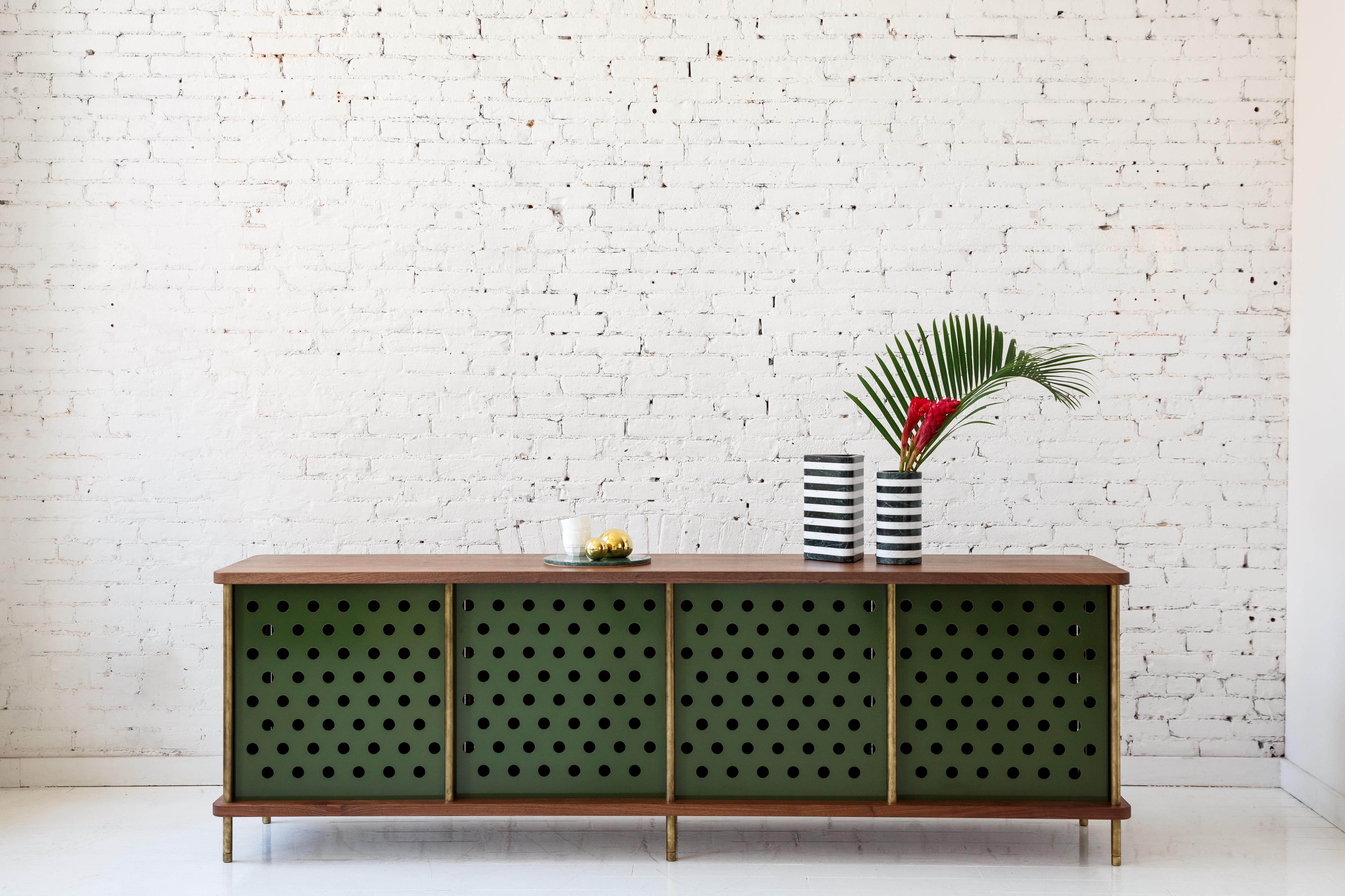 Consistent with the Strata collection, the new Strata credenza is designed to be modular in order to create versatile configurations tailored to your needs. Immediately available as shown with brass rods, walnut top and four powder coated aluminum