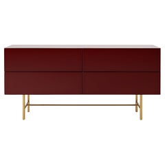 Console contemporanea a 4 cassetti in lacca lucida con base in ottone