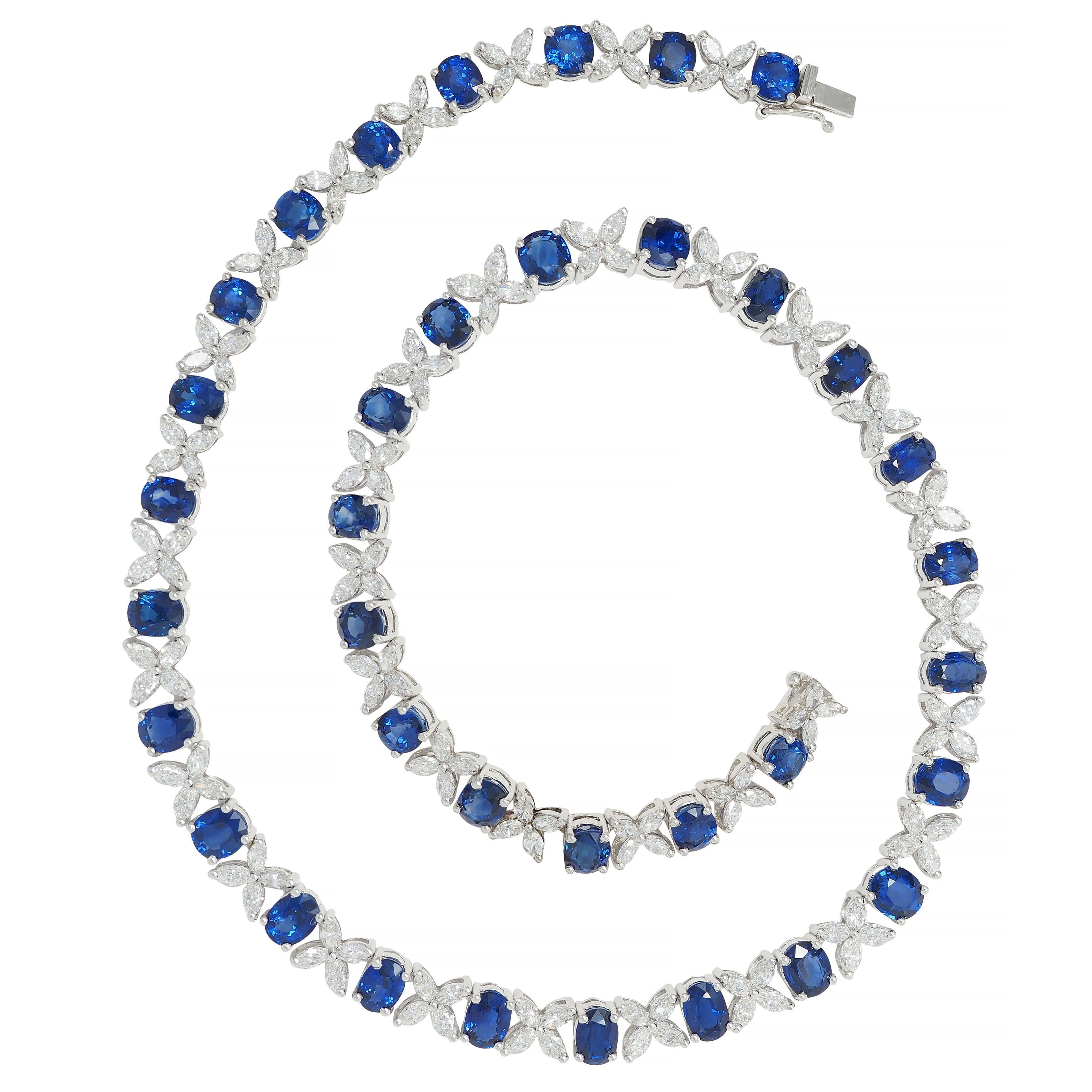 Comprised of hinged basket links featuring cushion cut sapphires prong set throughout
Weighing approximately 30.96 carats total - transparent medium blue in color
Alternating with clusters of marquise cut diamonds prong set as floral motif
Weighing