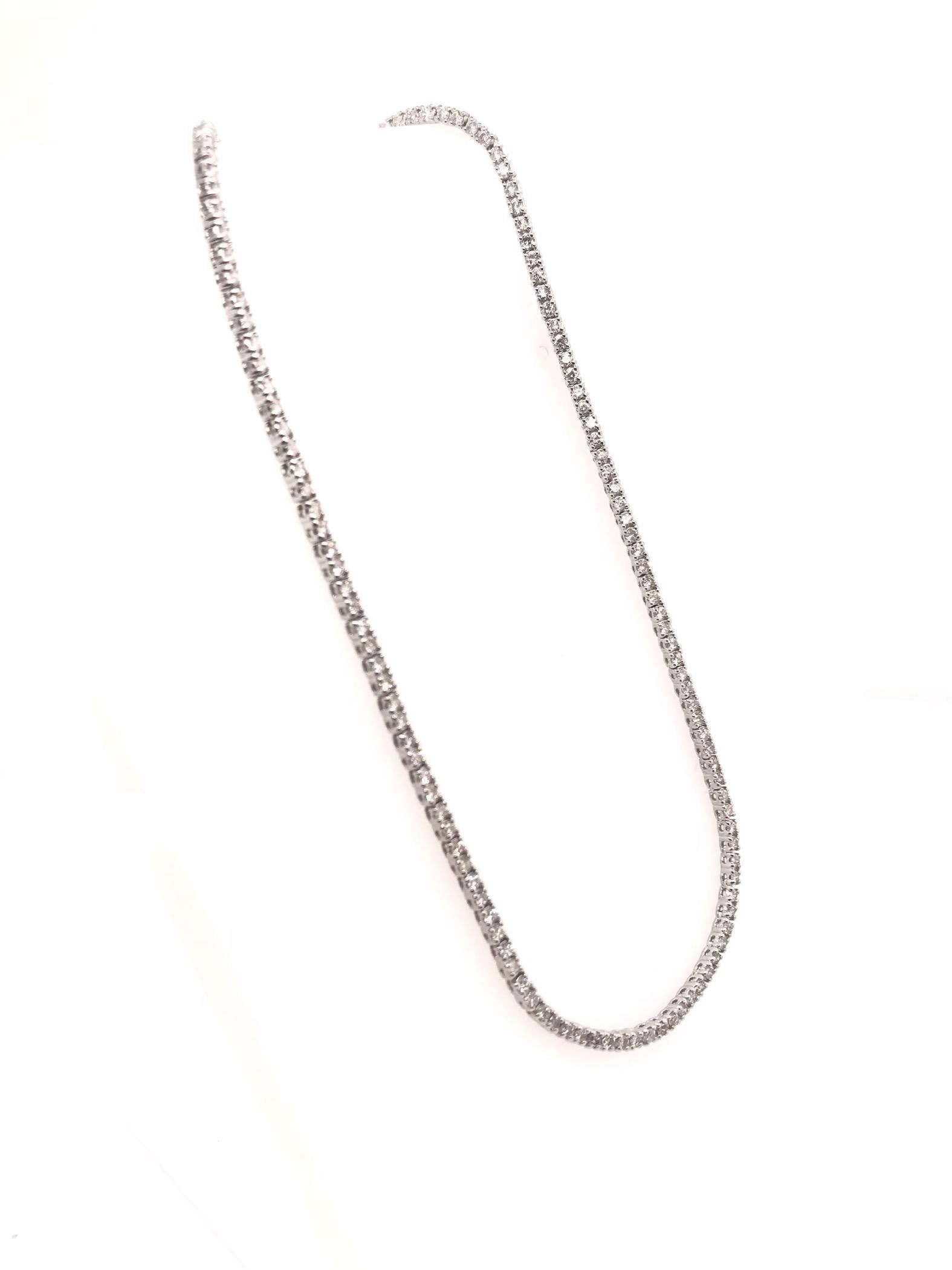 This contemporary diamond necklace features approximately 4.40 carats of diamonds. This simply sparkling diamond style is perfect for layering. We suggest pairing it with your gold pieces to bring a more curated style into your everyday jewelry