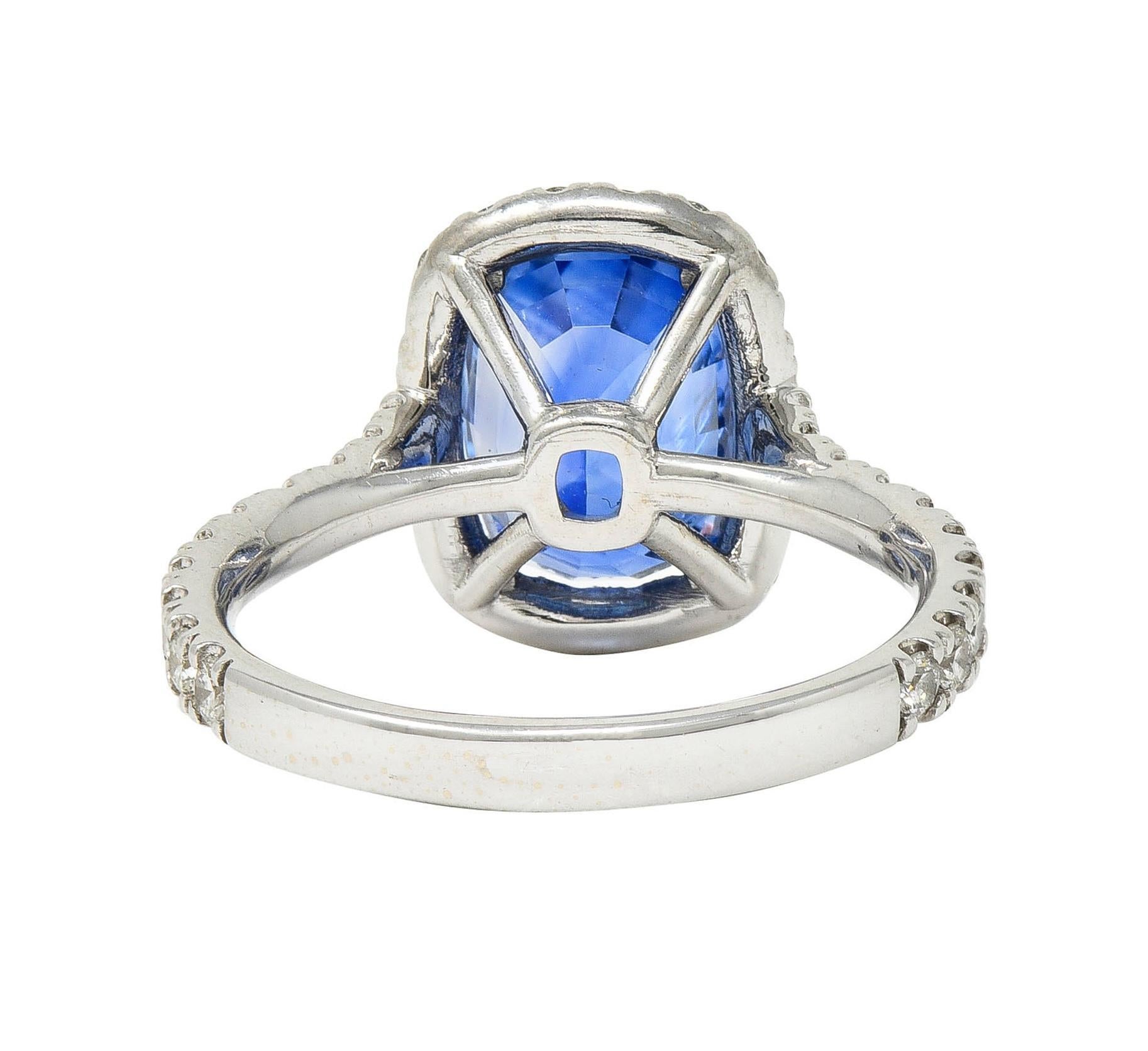 Women's or Men's Contemporary 4.67 CTW Sapphire Diamond 18 Karat White Gold Halo Ring For Sale