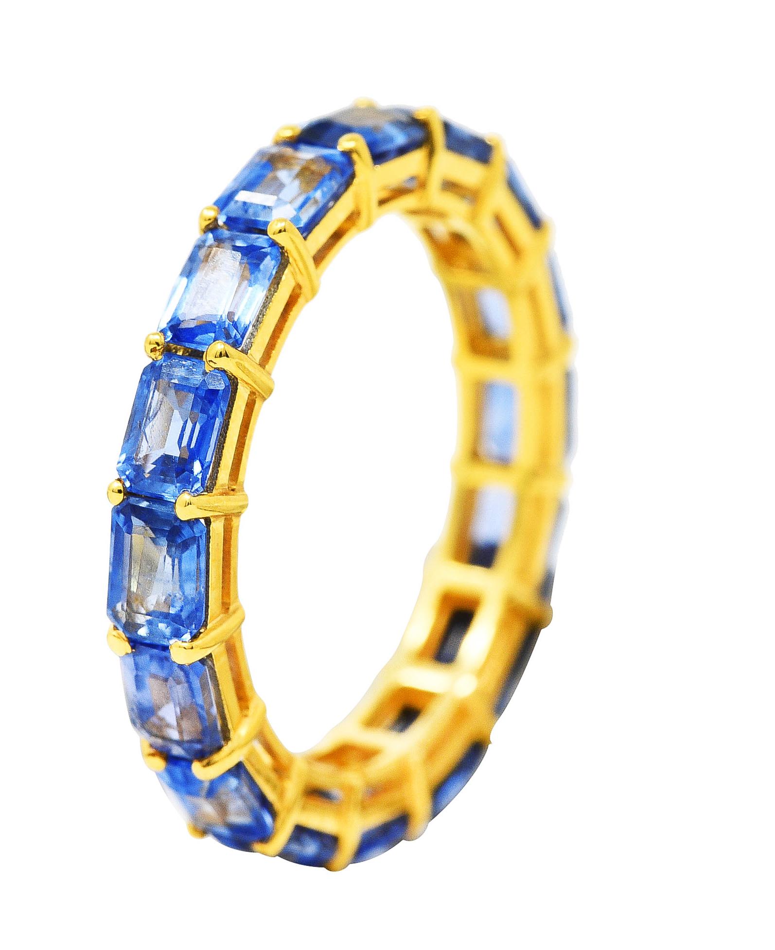 Comprised of emerald cut sapphires prong set East to West in wire baskets fully around. Weighing approximately 4.80 carats total. Transparent light to medium blue in color. Completed by high polished gold finish. Tested as 18 karat gold. Circa;