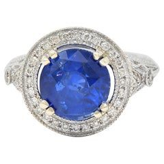 Contemporary 4.84 CTW Sapphire Diamond 14 Karat White Gold Halo Ring