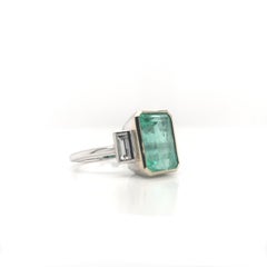 Contemporary 4.99 Carat Colombian Emerald and Diamond Ring