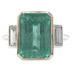 Contemporary 4.99 Carat Colombian Emerald and Diamond Ring