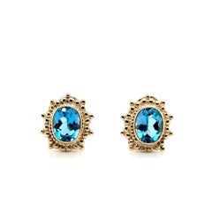 Orecchini Omega Back in oro giallo 14 carati con 5,24 carati di topazio blu