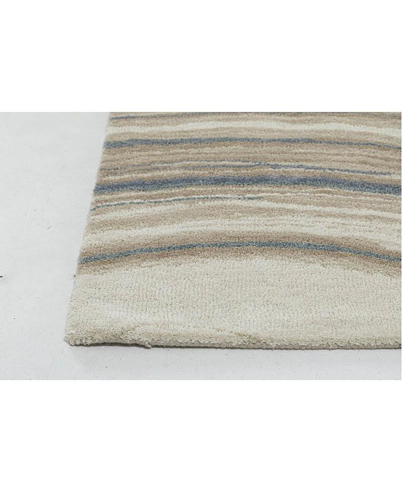 Introducing our exquisite 5'x7' Hand-Tufted Wool Rug adorned with graceful wavy stripes. Crafted with precision and care, this rug combines the timeless allure of wool with a modern design sensibility. The hand-tufted technique ensures not only