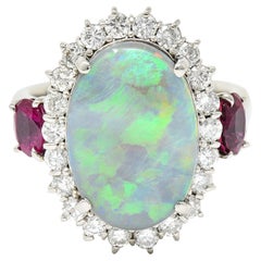 Contemporary 6.74 Carat Opal Diamond Ruby Platinum Halo Cluster Ring
