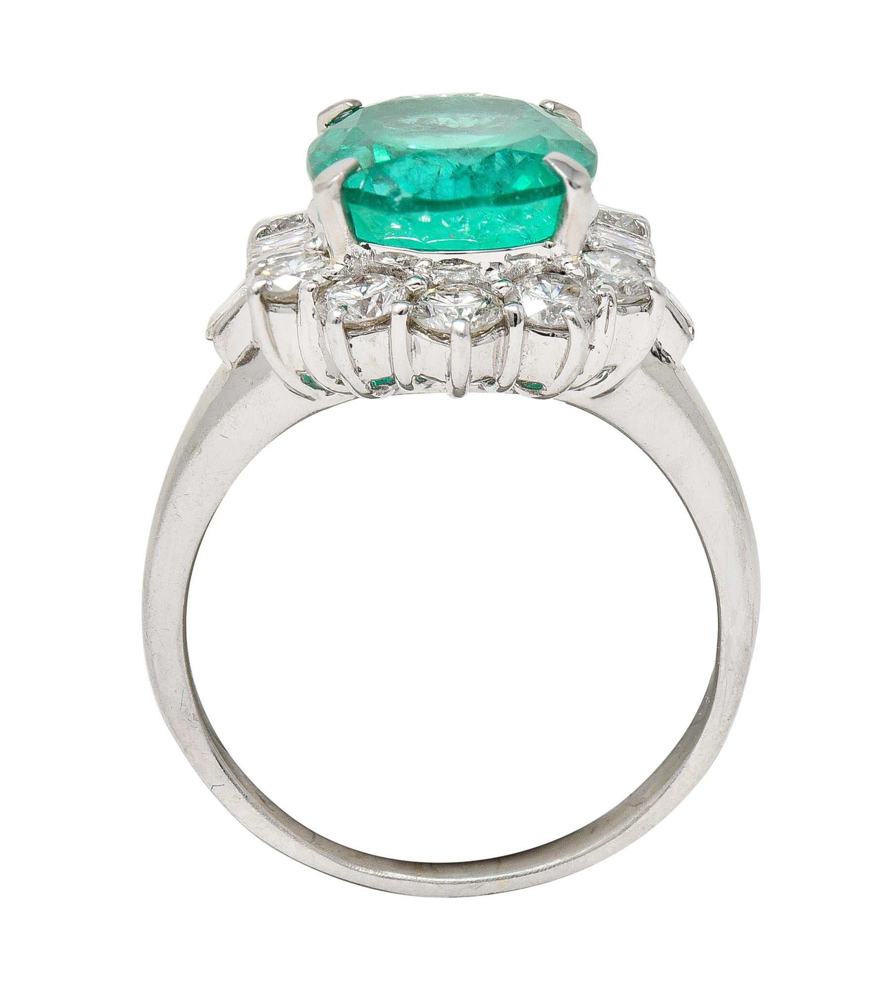 Contemporary 6.77 CTW Columbian Emerald Diamond Platinum Halo Ring GIA 4