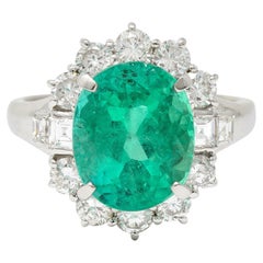 Contemporary 6.77 CTW Columbian Emerald Diamond Platinum Halo Ring GIA