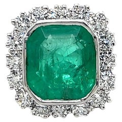Contemporary 6.79 Carat Emerald & 2.3 TCW Diamond Platinum Cocktail Ring