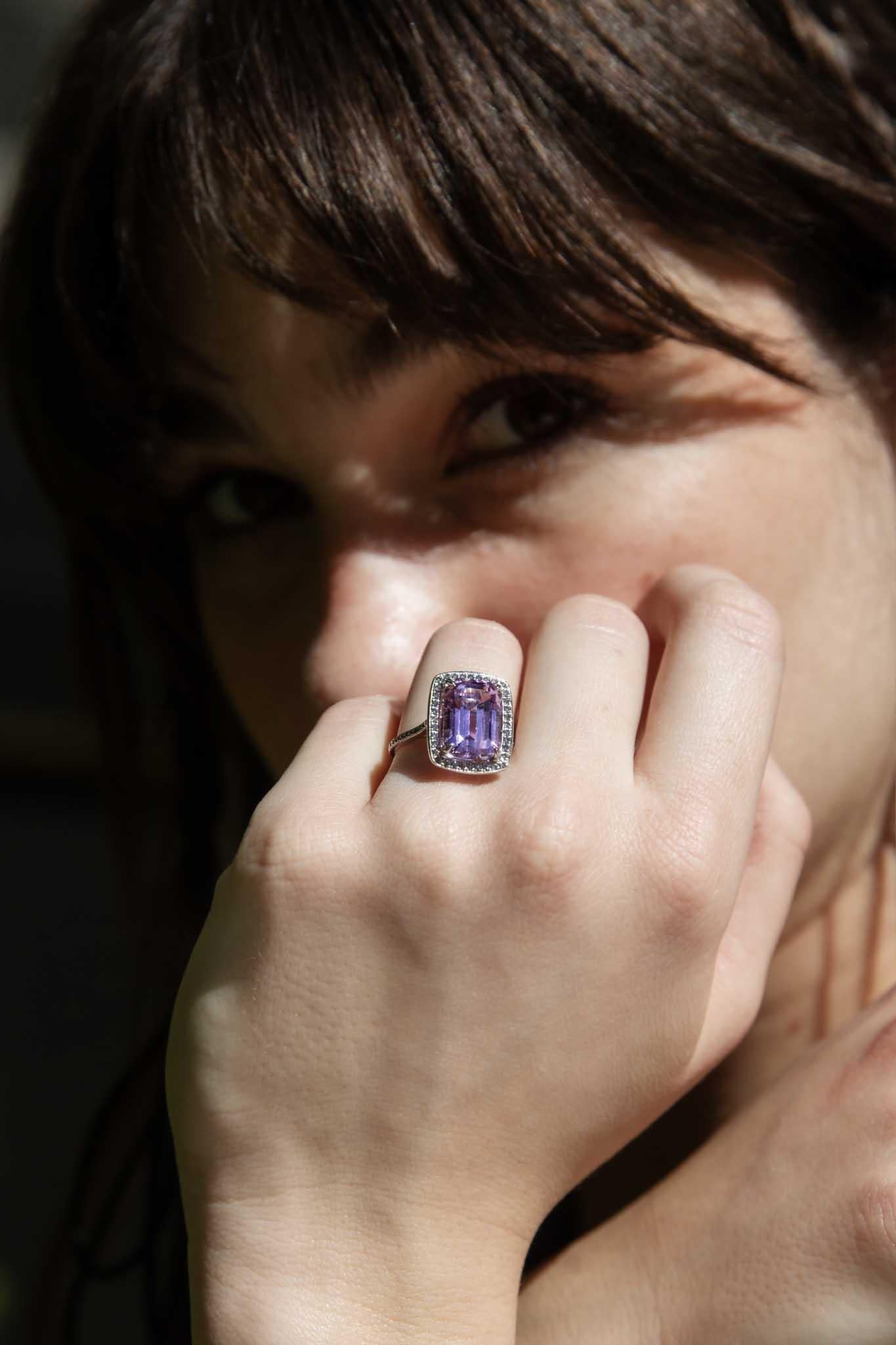 A blushing beauty with a heart of love, The Claudia Ring showcases a captivating 7.18 carat emerald cut Kunzite, her radiant purple hue evocative of dusk on warm summer days. Framed in a halo of shimmering diamonds she is a glamorous beauty. 

The
