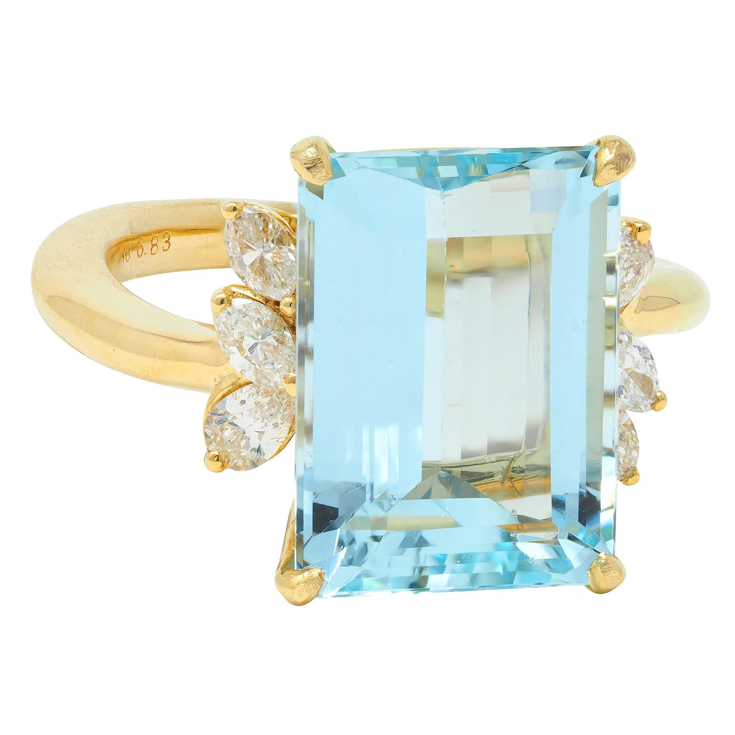 Centering an emerald cut aquamarine weighing 6.83 carats - transparent light blue in color
Prong set in basket and flanked by clusters of marquise cut diamonds 
Weighing 0.44 carat total - G color with VS clarity
Prong set in tiered