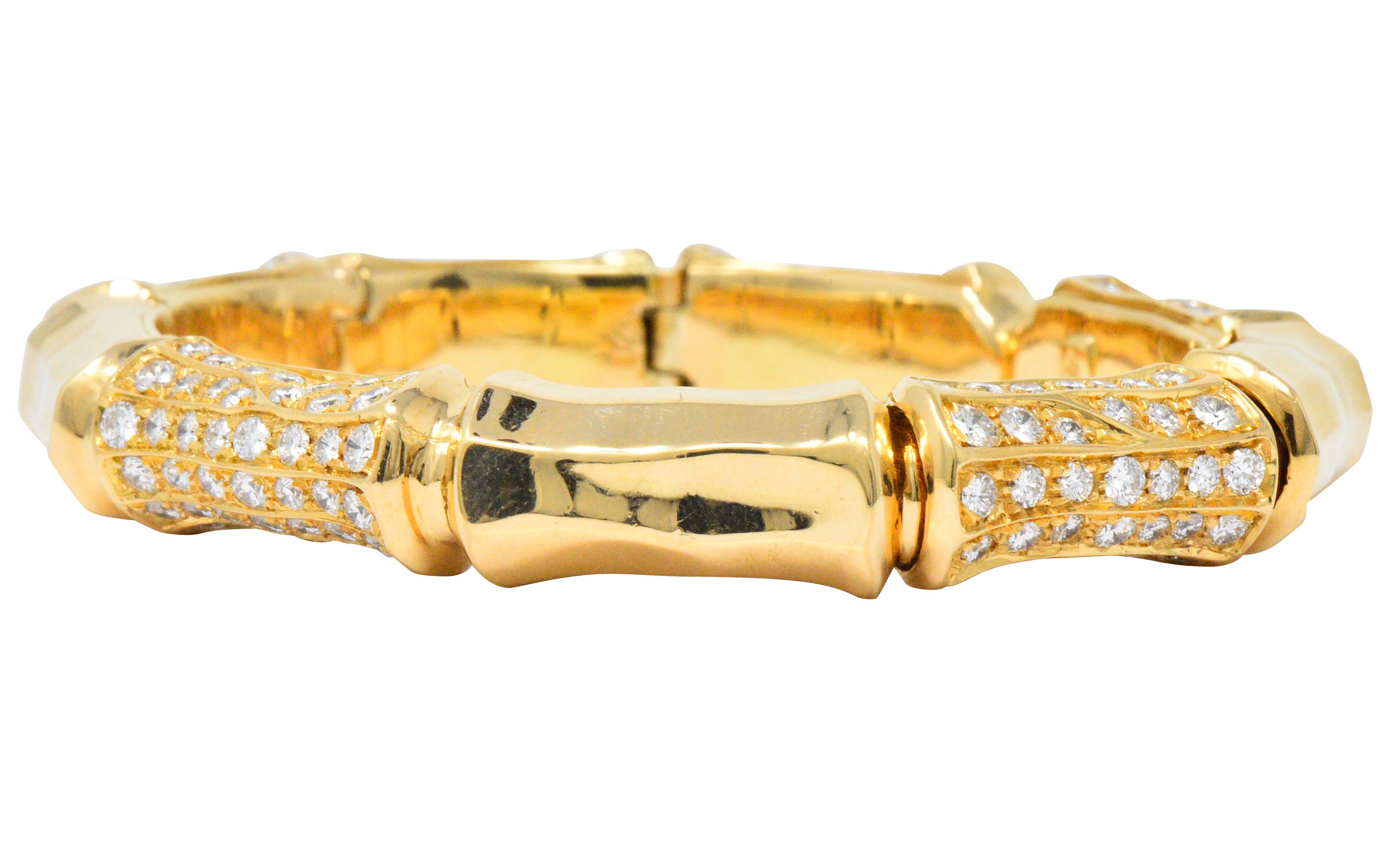 Flexible bangle cuff bracelet comprised of highly polished bamboo style links

Five links are deeply grooved with channels that are bead set with round brilliant cut diamonds

Total diamond weight is approximately 7.50 carats, F/G color with VS