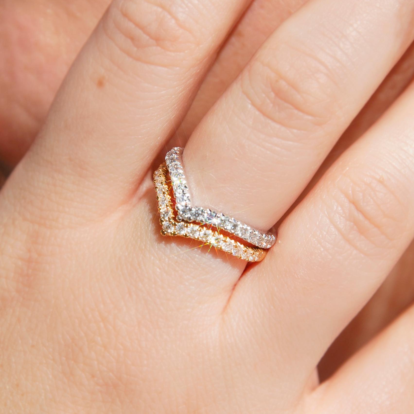 Crafted in 18 carat white gold, this light contemporary ring features a chevron setting set with nineteen glistening round brilliant diamonds. The Rhada Ring makes a seamless transition from day to night and looks wonderful alone or stacked with