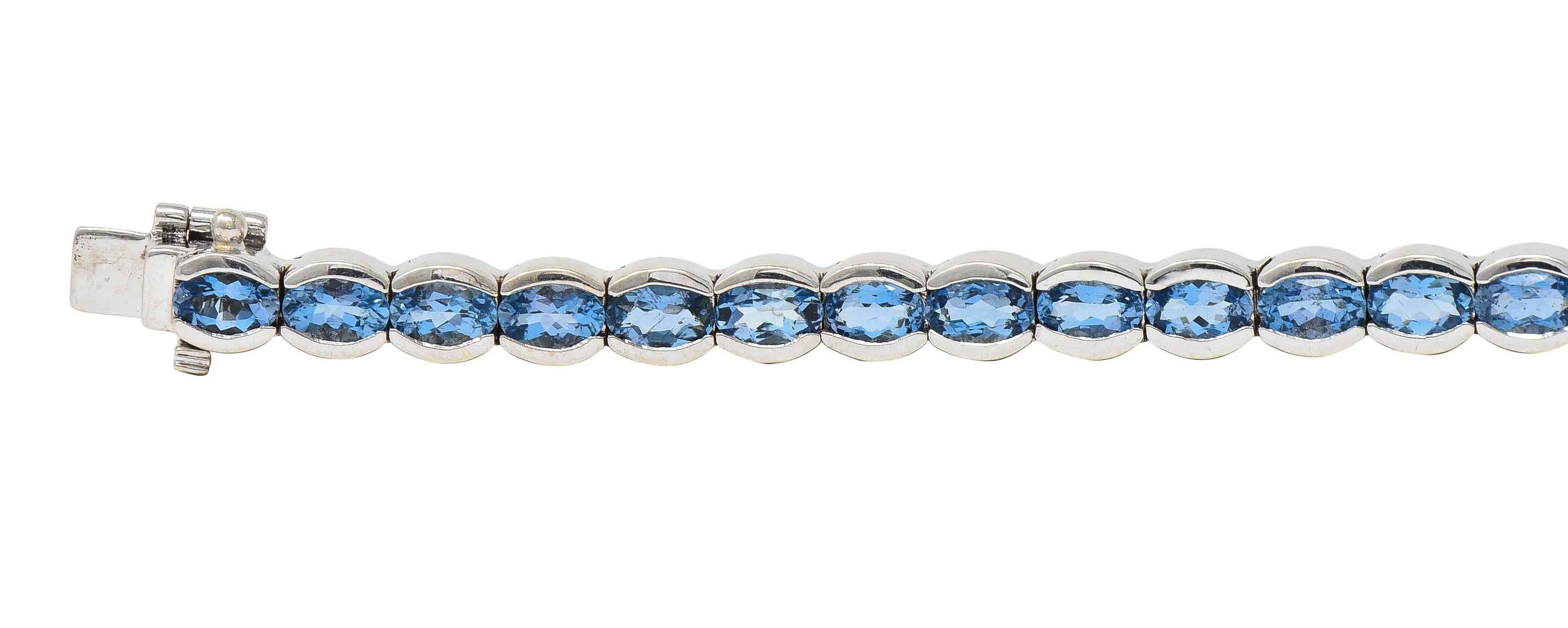 Women's or Men's Contemporary 9.80 CTW Blue Topaz 14 Karat White Gold Line Bracelet For Sale