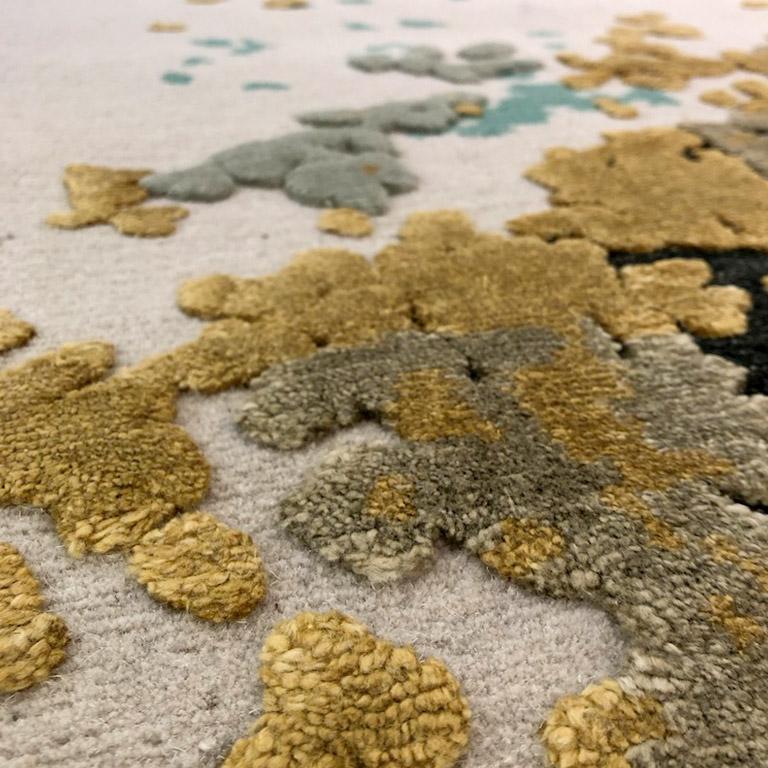 Vivid colors reflect the idea of being in a beautiful garden any time of the year. Hand carded bamboo silk and high-quality Himalayan wool coupled with abstract flower garden design, offer a crisp understated mood that goes hand in hand with