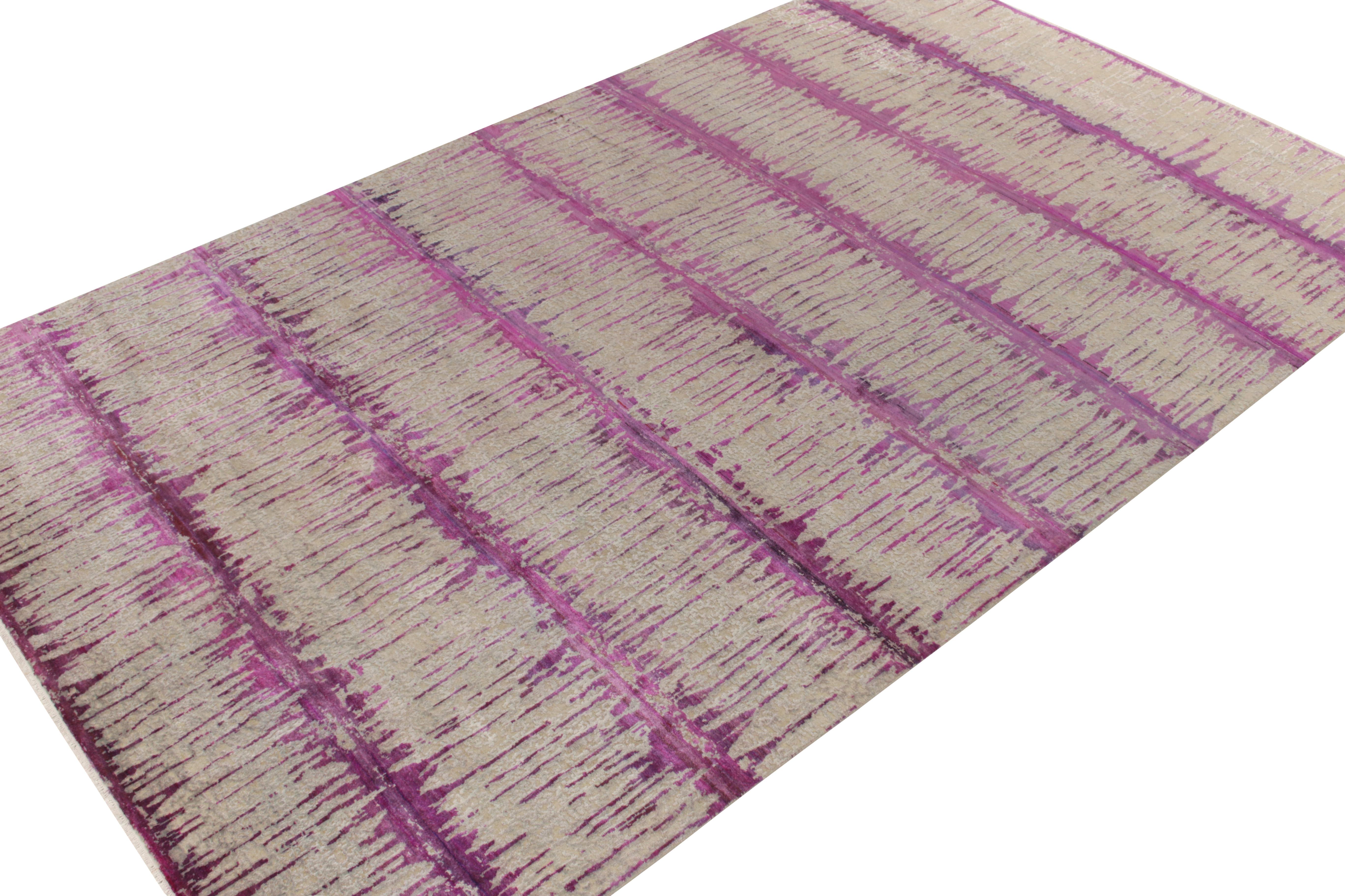 An 8 x 14 hand-knotted custom rug design, available from Rug & Kilim’s abstract designs in their New & Modern collection, making a distinct take in contemporary style with an intriguing pink & purple colorway confidently carrying the elegance of