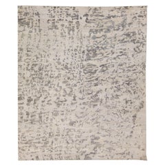 Tapis contemporain abstrait en laine grise et beige fait à la main