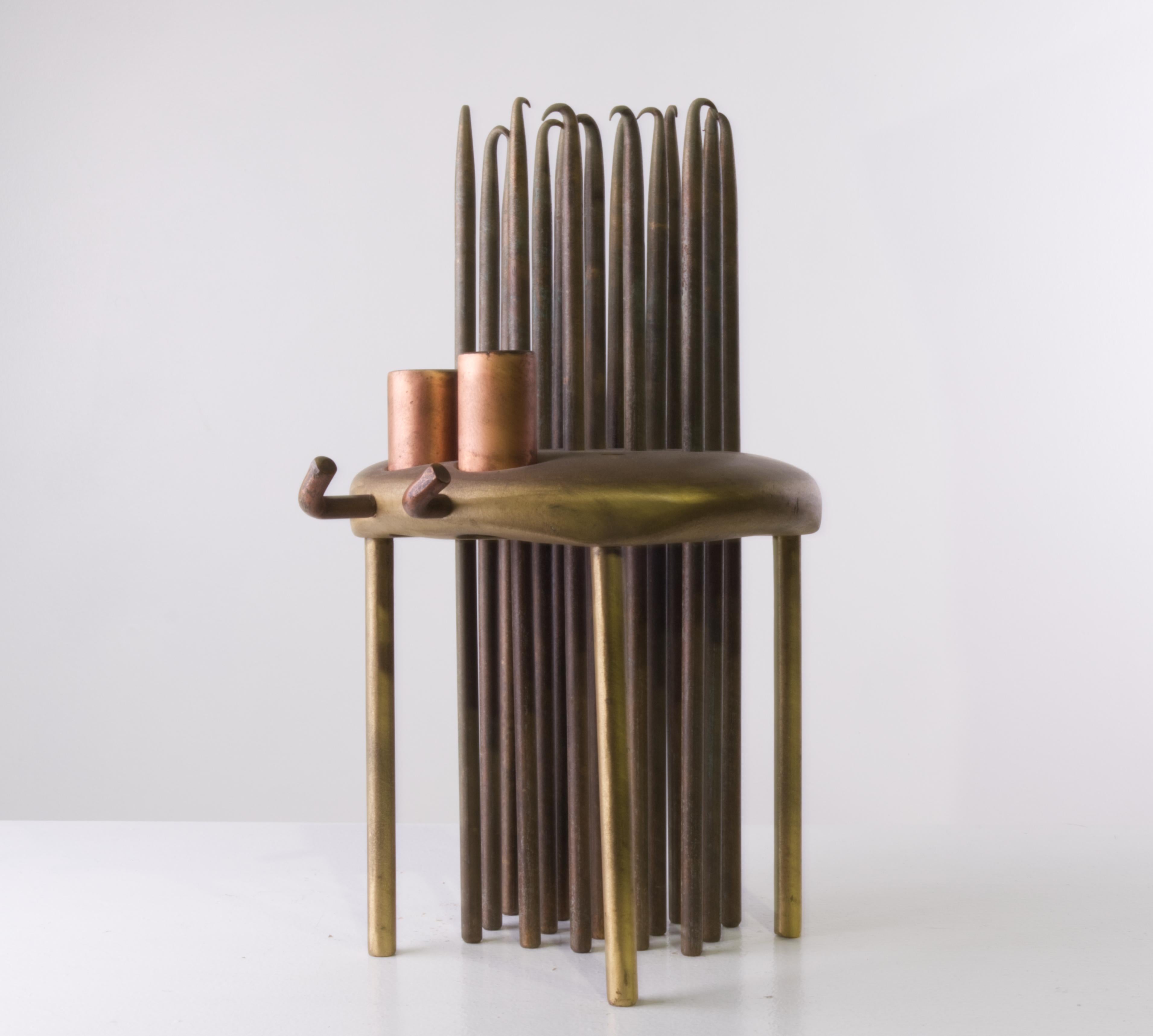 'Artist Microscope' is an abstract sculpture crafted from bronze and copper, embodying the unique perspective of an artist. Featuring removable and movable components, this interactive piece symbolizes the fluid and ever-evolving way artists