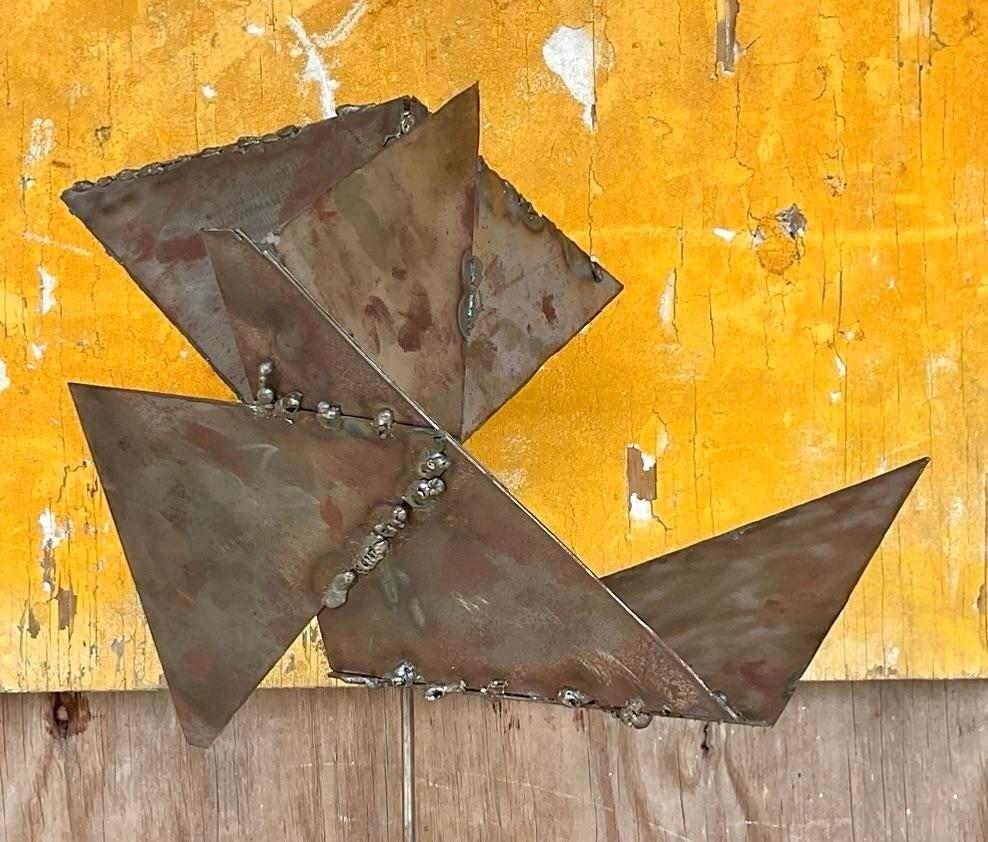 A stunning Contemporary Original sculpture. A chic Abstract composition forged from welded steel. A kinetic structure adds movement to any space. Acquired from a Palm Beach estate.