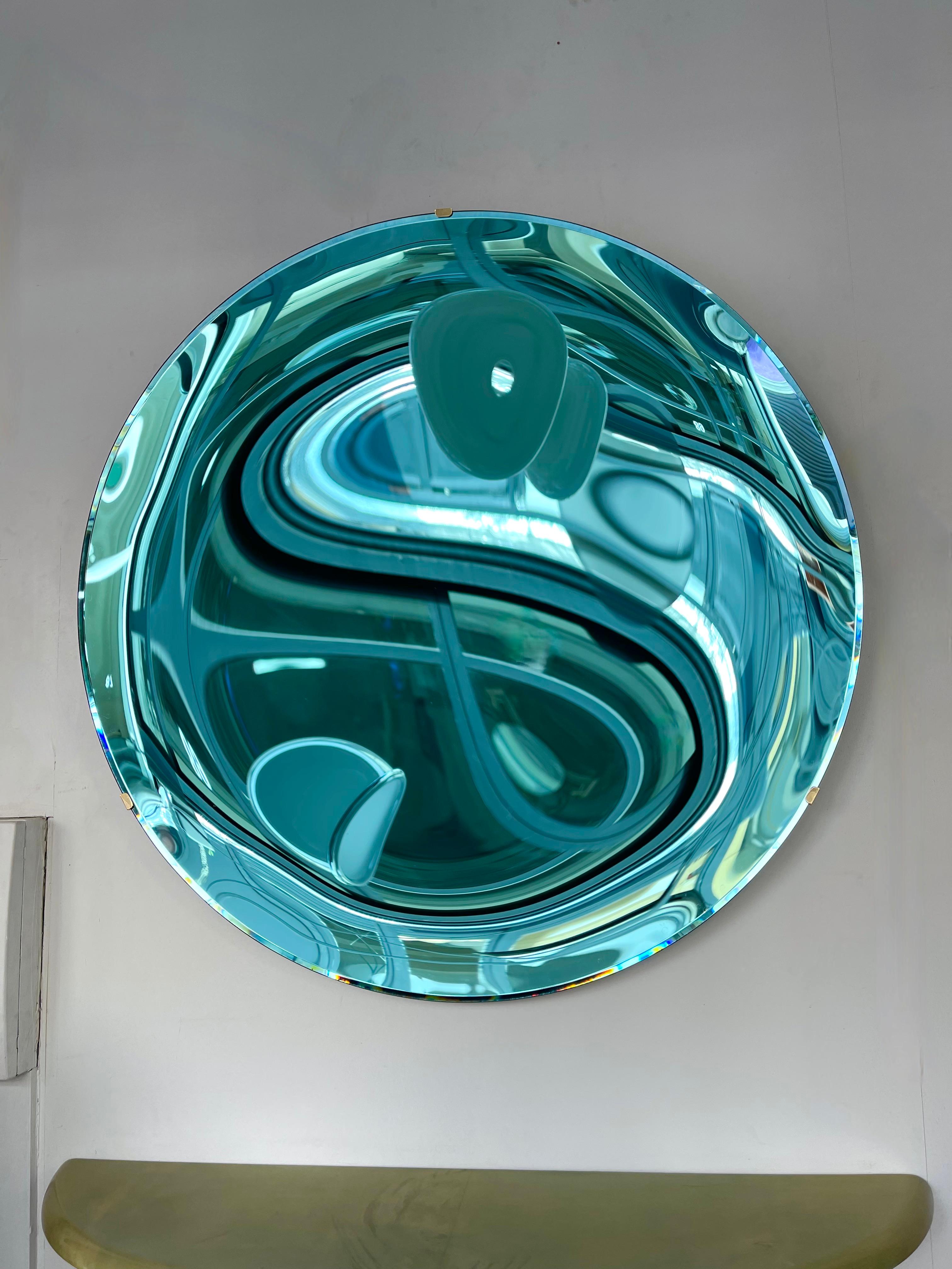Contemporary curve concave sculpture bleu green acquamarina wall mirror, brass structure.