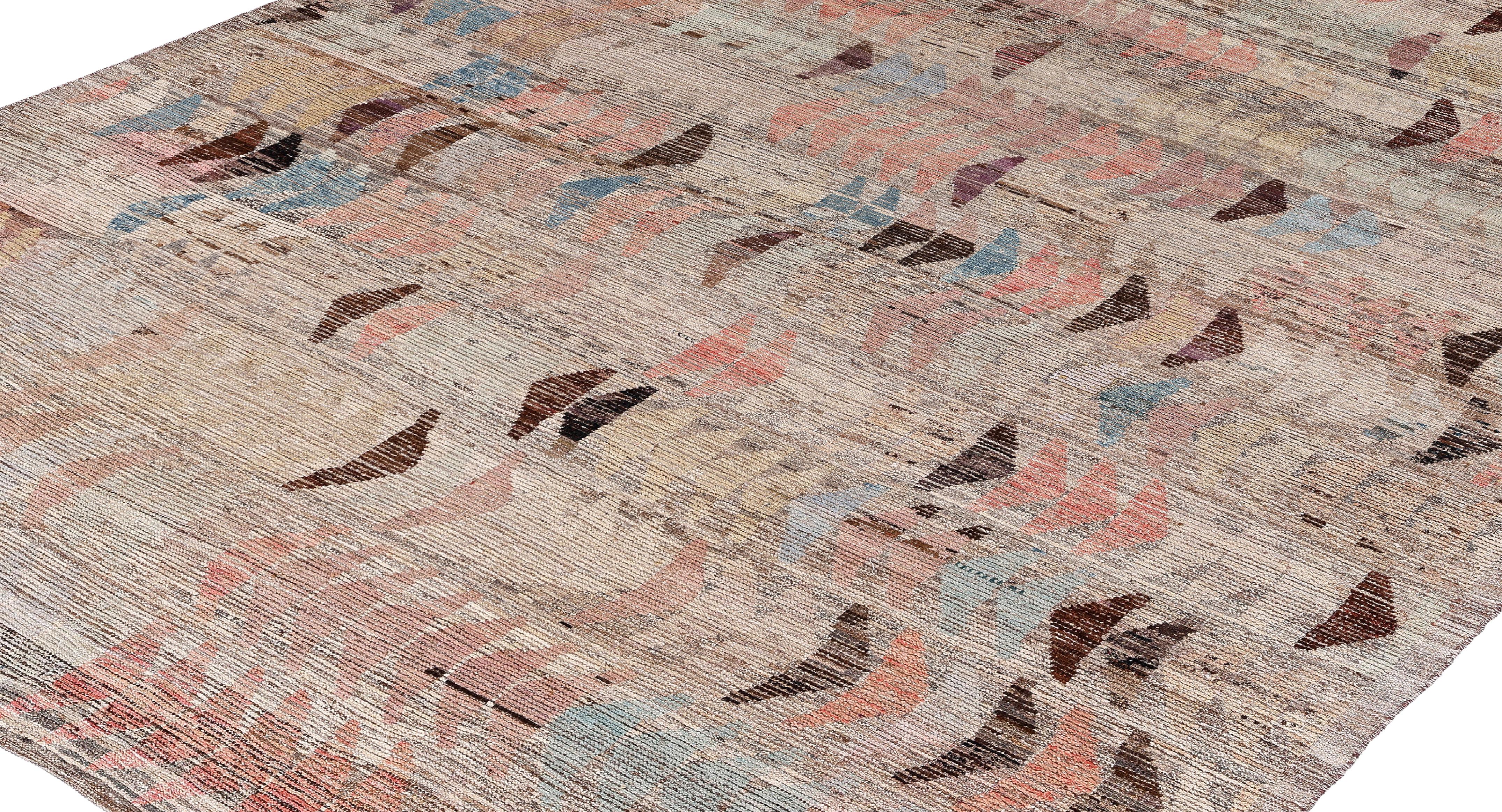 This contemporary Afghan rug is a handwoven masterpiece, crafted with hand-spun wool and colored using natural vegetable dyes. Its palette of soft neutrals is enhanced by subtle arrow-like motifs in muted tones of rose, blue, brown, and beige,