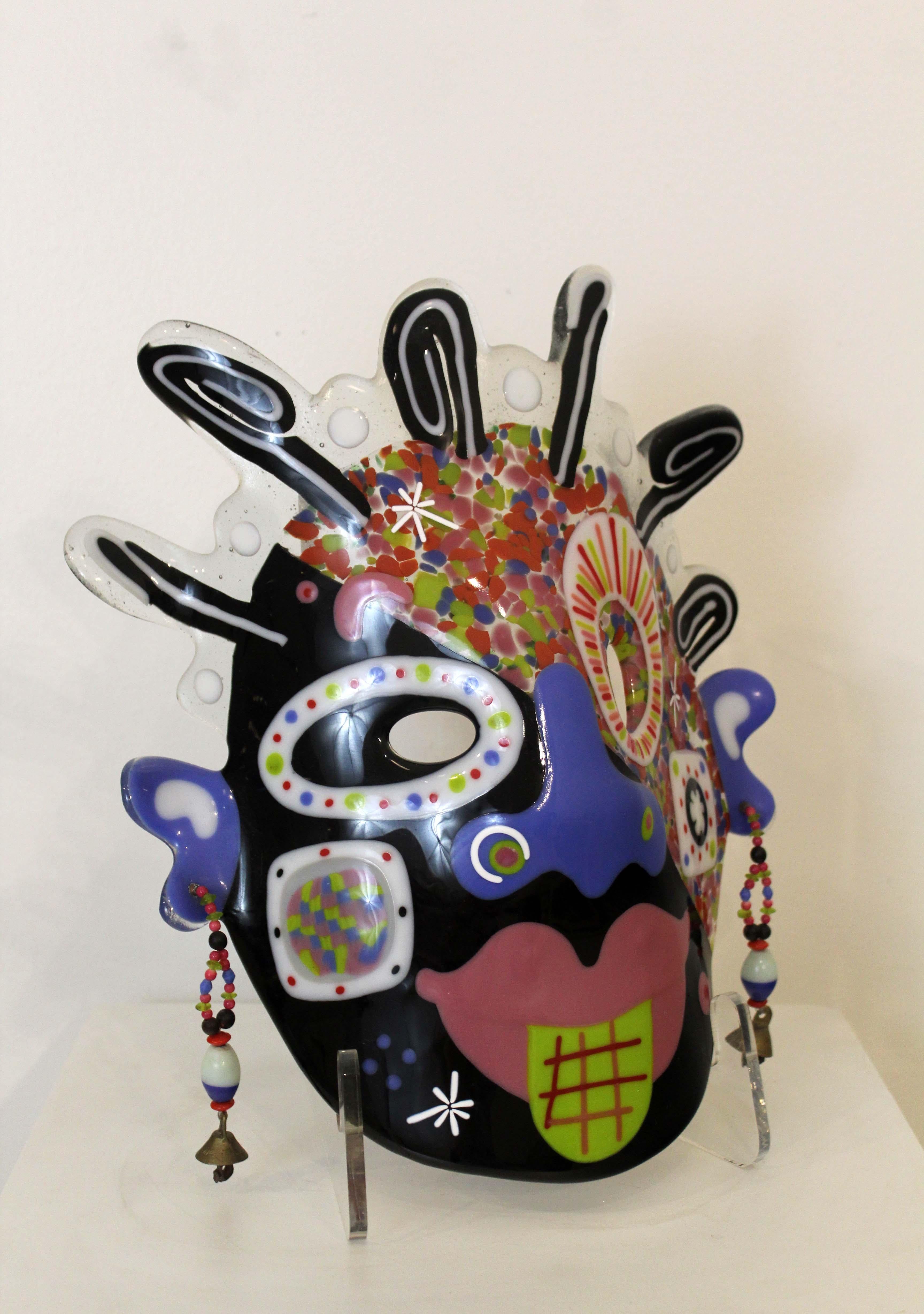 An artful and eclectic contemporary interpretation of an African mask. Made with painted and fused glass with a beaded designs by famed glass artist Ruth Brockman, 1985. A fantastic addition to a modern or contemporary space. Dimensions: 10.5