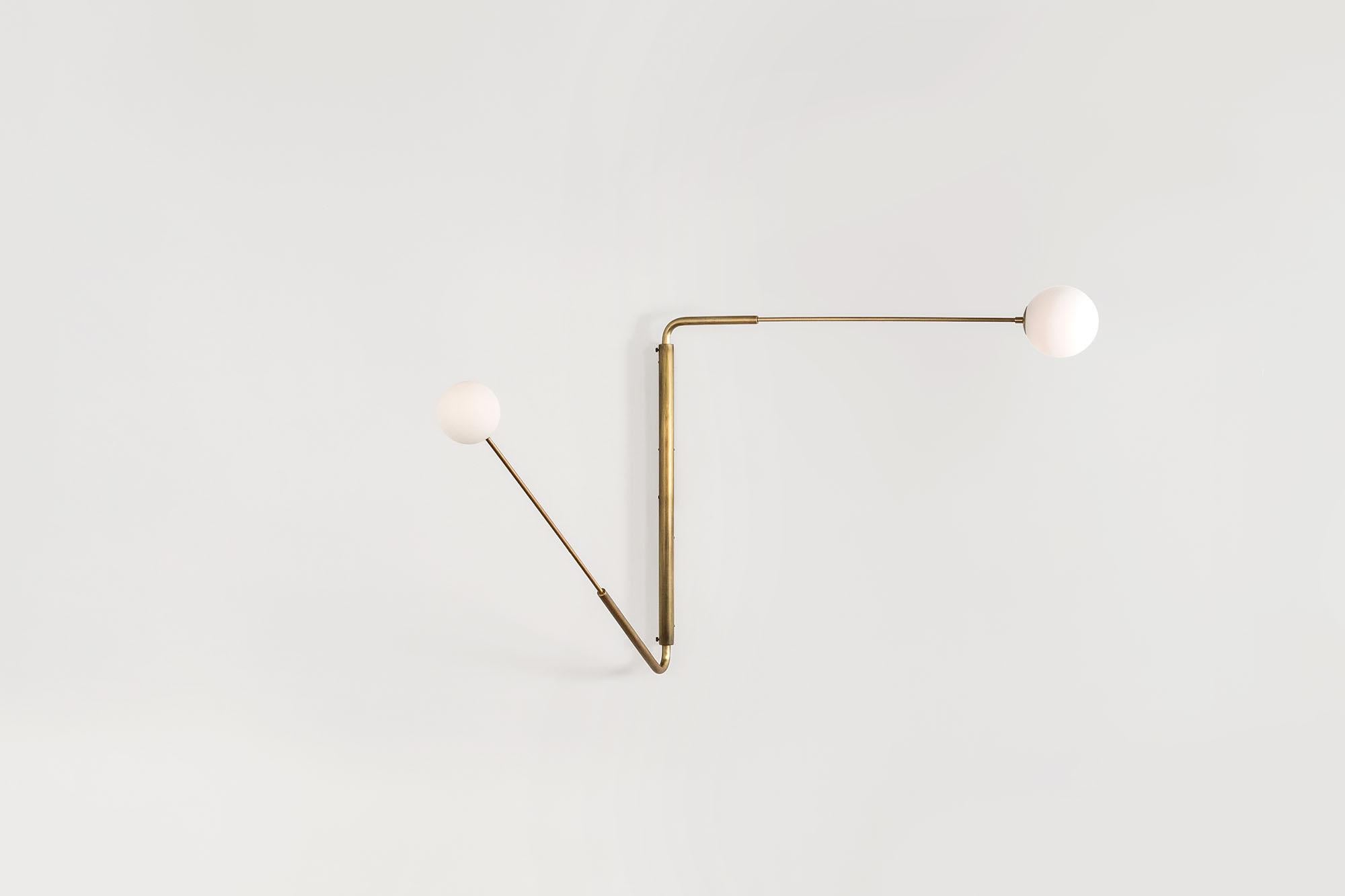 Contemporary Aged Brass Swing Arm Wall Sconce, Flutter One by Paul Matter

The long rotating arms are attached to a vertical, wall-mounted spine that results in a Minimalist yet oversized fixture. Flutter comes in three variations, each with two