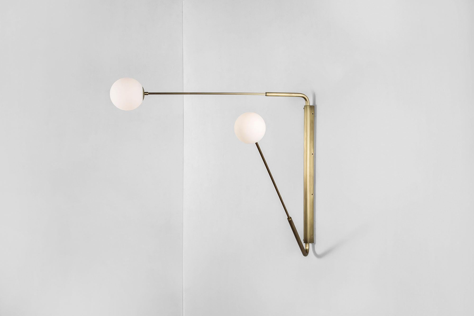 Contemporary Aged Brass Swing Arm Wall Sconce, Flutter One by Paul Matter

The long rotating arms are attached to a vertical, wall-mounted spine that results in a Minimalist yet oversized fixture. Flutter comes in three variations, each with two