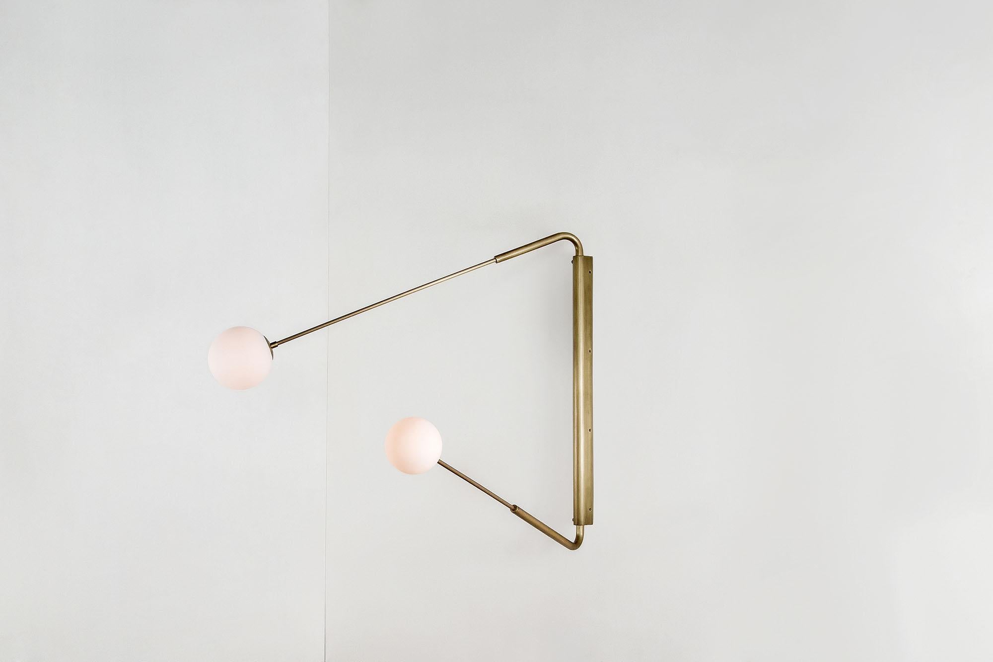 Contemporary Aged Brass Swing Arm Wall Sconce, Flutter Two by Paul Matter

The long rotating arms are attached to a vertical, wall-mounted spine that results in a Minimalist yet oversized fixture. Flutter comes in three variations, each with two