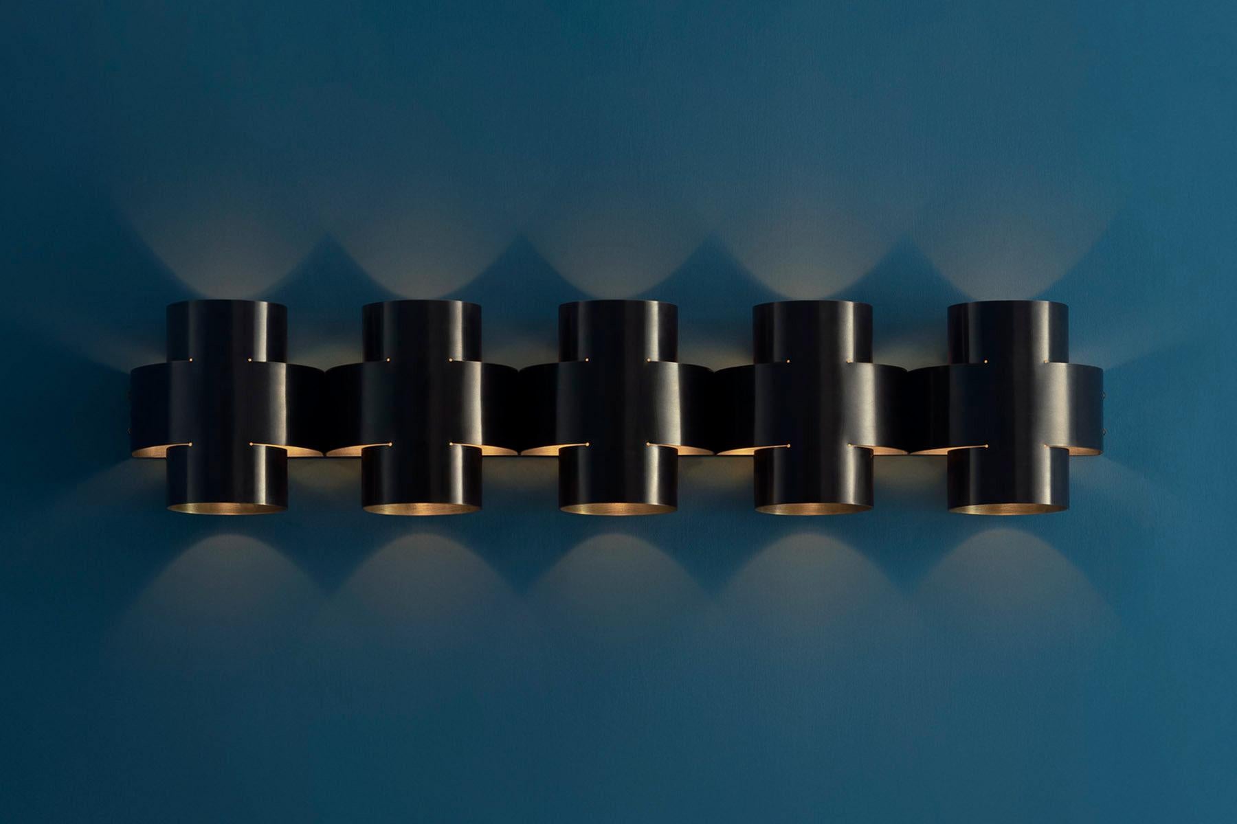 Contemporary Aged Brass Wall Sconce, Plus Five Appliqué by Paul Matter

PLUS Series is a new range of appliqués by Paul Matter that feature a simple shape in singular and repetitive arrangements. A 3-Dimensional plus is formed out of a single tube