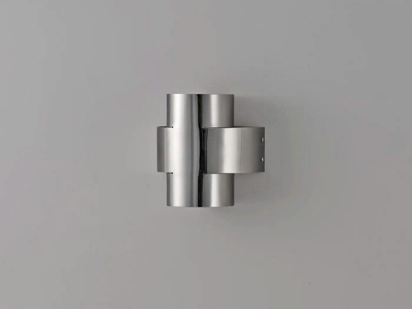 Contemporary Aged Brass Wall Sconce, Plus One Large Lamp by Paul Matter

PLUS Series is a new range of appliqués by Paul Matter that feature a simple shape in singular and repetitive arrangements. A 3-Dimensional plus is formed out of a single tube