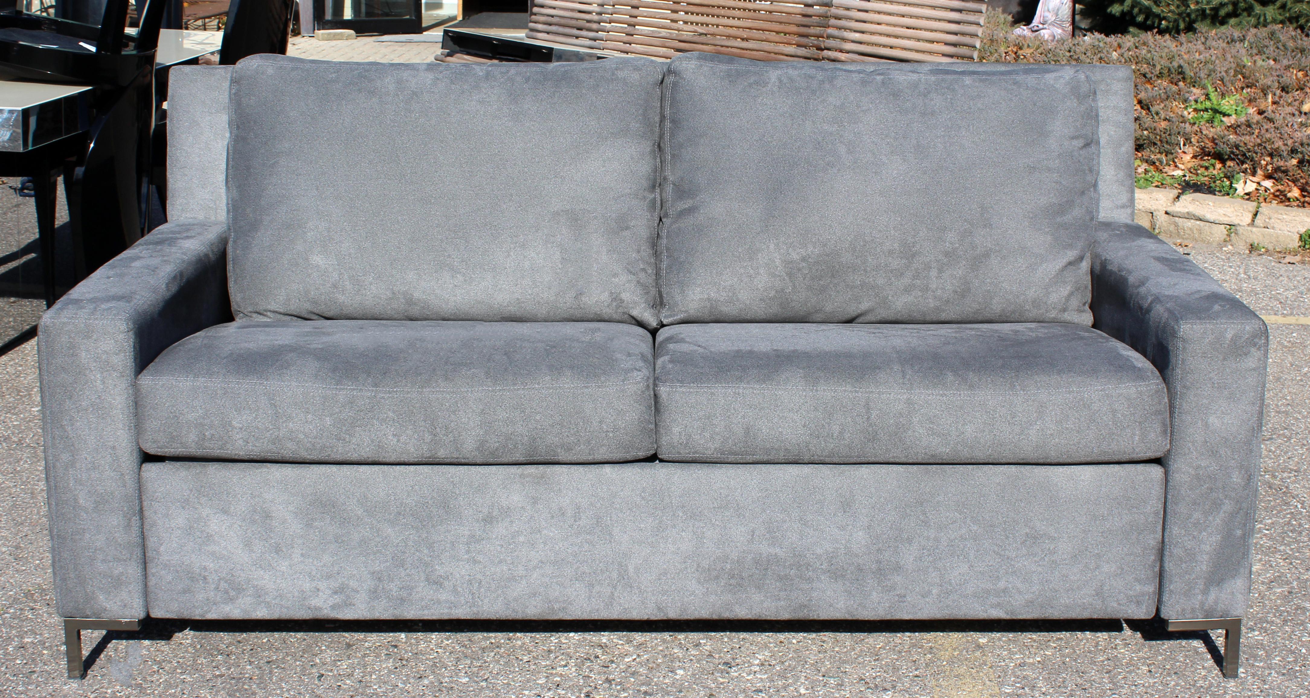 For your consideration is a plush, gray, convertible sleeper sofa by American Leather Co. Sleeper sofa with deluxe mattress. In excellent condition. The dimensions are 74