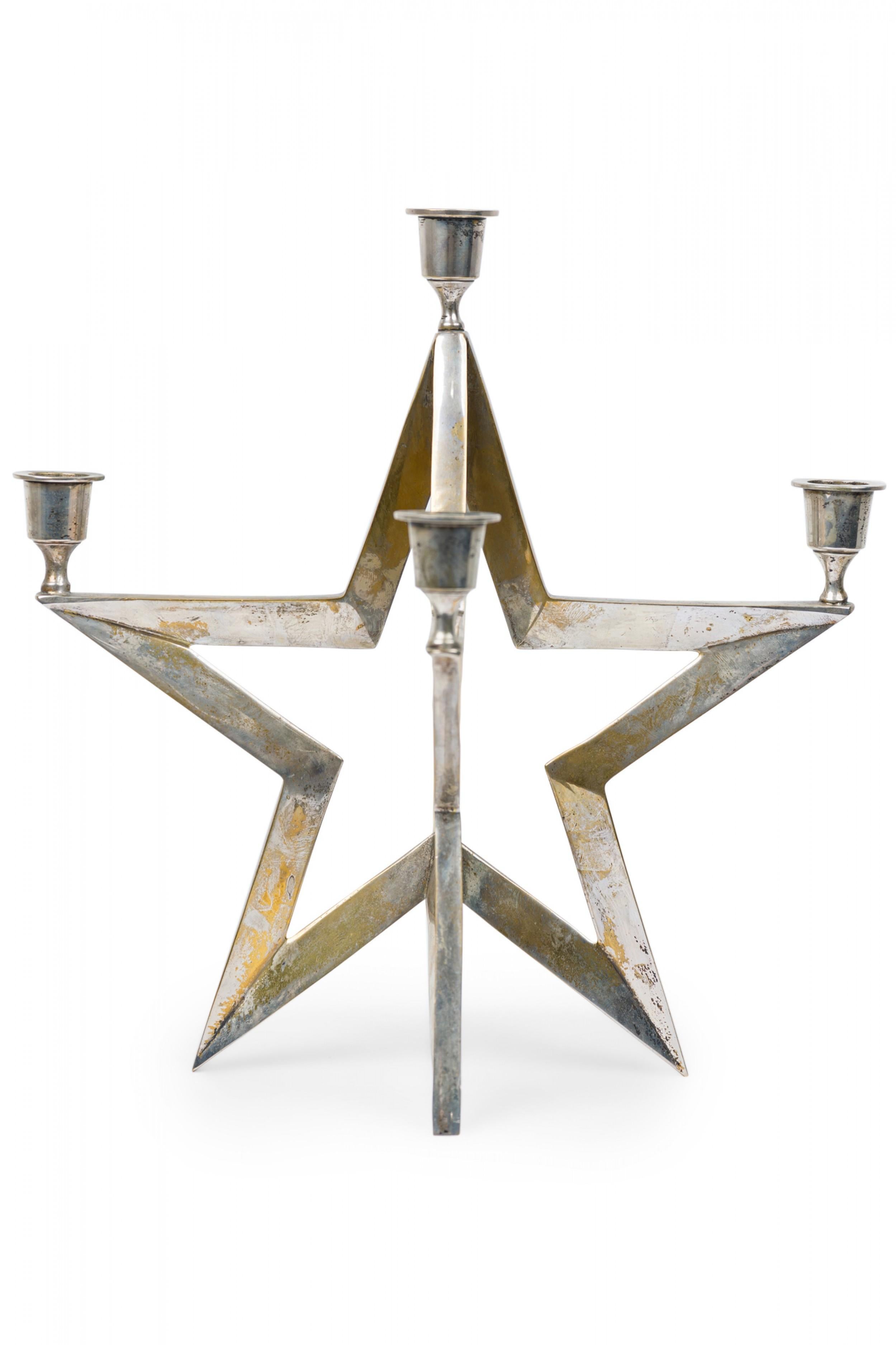 Contemporary American star form metal candle with 5 arms with candle cups.