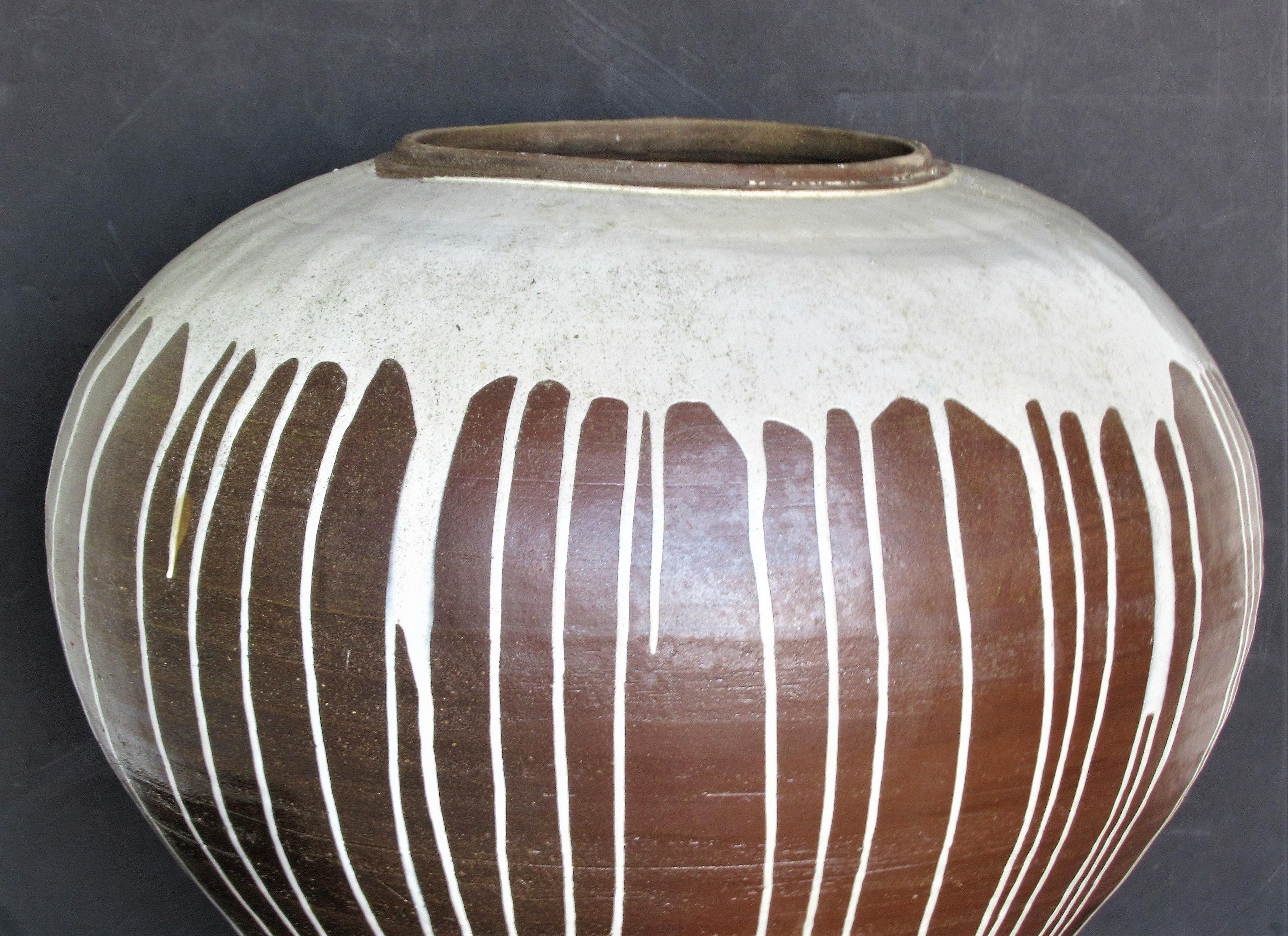 A massive bulbous ovoid glazed stoneware ceramic vase. A contemporary work from The School for American Craftsmen at Rochester Institute of Technology. No apparent signature. This is a beauty. Look at all pictures and read condition report in
