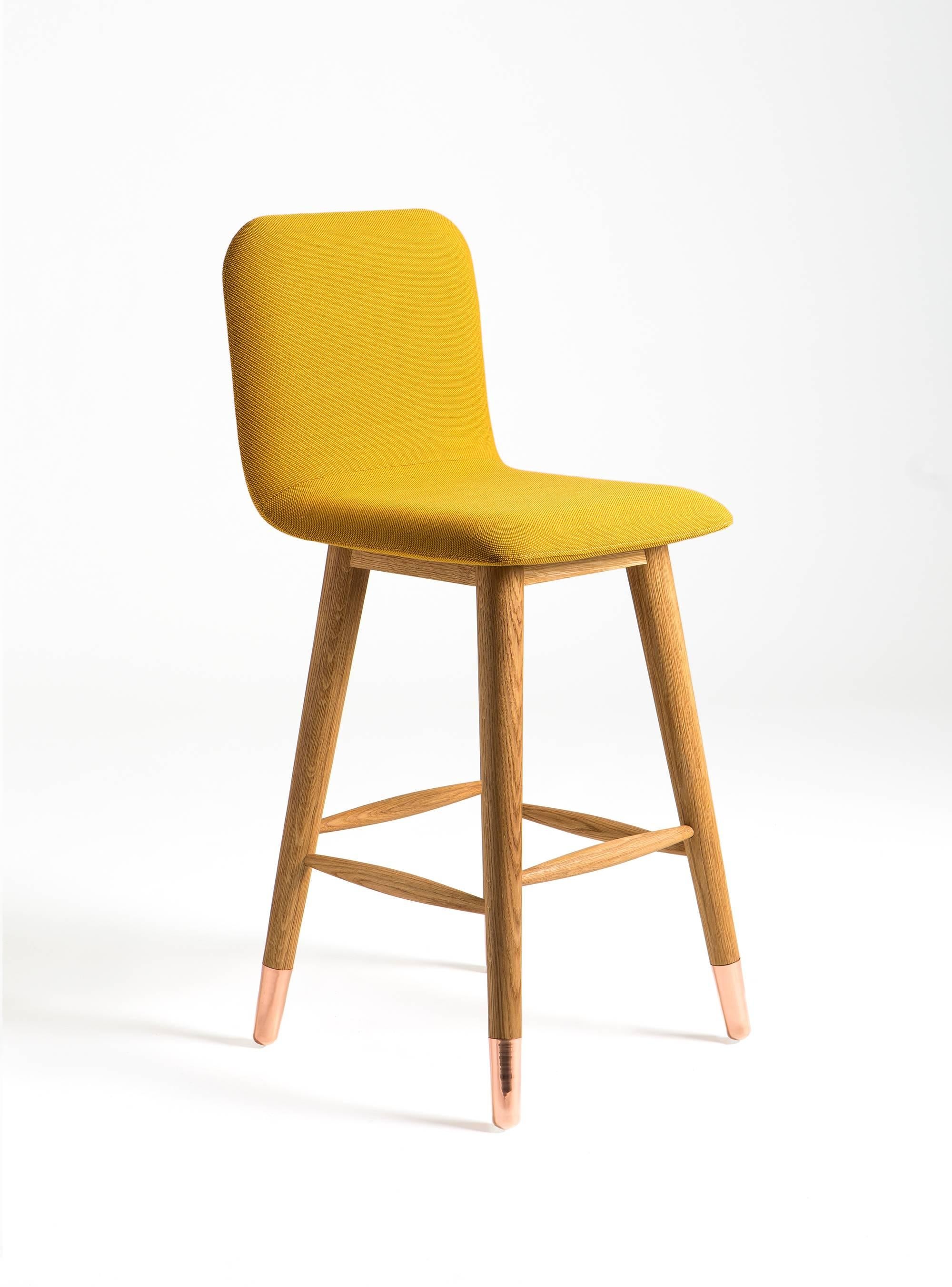 Mistral bar stool is designed to bring fresh, modern, natural style to its environment. Polished copper and white American oak legs are combined with colorful fabrics.
