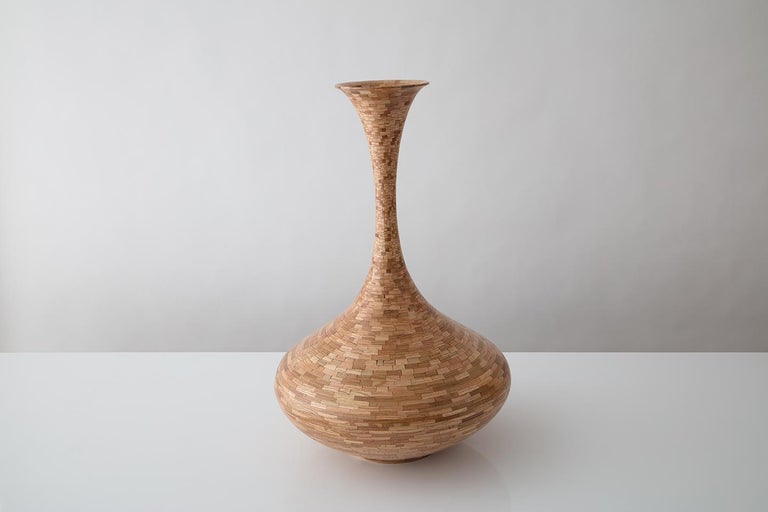 Part of Richard Haining's STACKED Collection, this wooden vase is made from reclaimed red and white oak. The salvaged wood was sourced from a variety of local Brooklyn wood shops, as well as from deconstructed turn of the century mill and factory