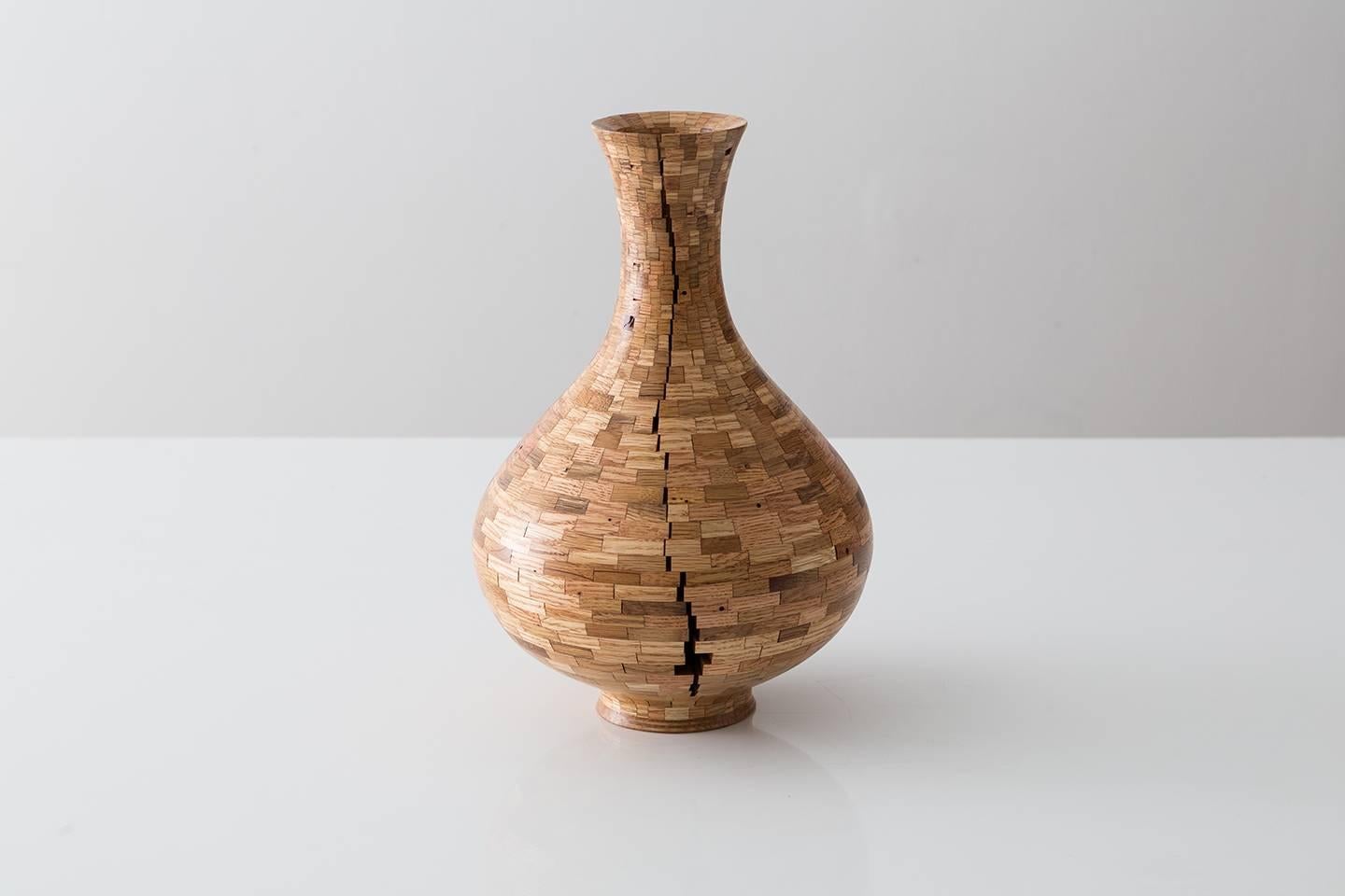 Part of Richard Haining's Stacked collection, this asymmetrical vessel utilizes reclaimed red and white oak. The salvaged wood offcuts were sourced from a variety of local Brooklyn wood shops, as well as from deconstructed turn of the century mill