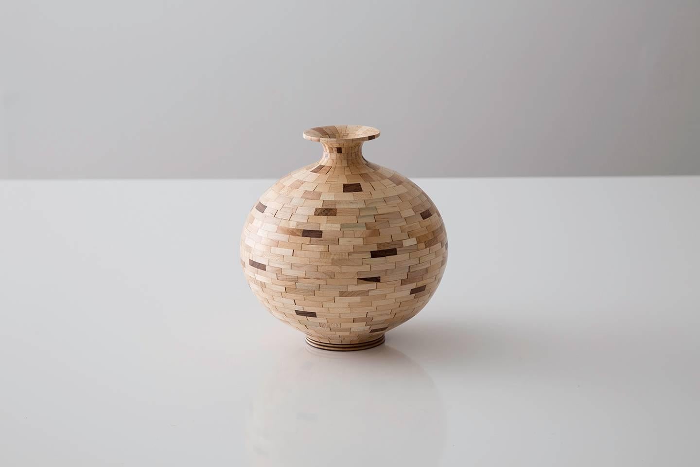 Part of Richard Haining's STACKED Collection, this vessel uses a combination of reclaimed walnut and maple. The salvaged wood offcuts were sourced from a variety of local Brooklyn wood shops. The intentional choice to use two highly contrasting