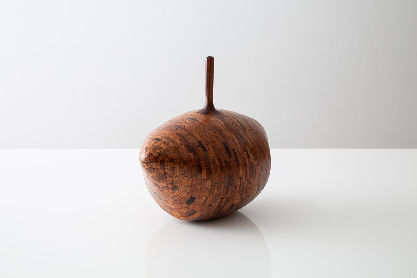Part of Richard Haining's STACKED Collection, this vase was made using reclaimed California redwood salvaged from a decommissioned NYC water tower. The wood's natural coloring shows off tones ranging from pink and deep reds to almost black in color.