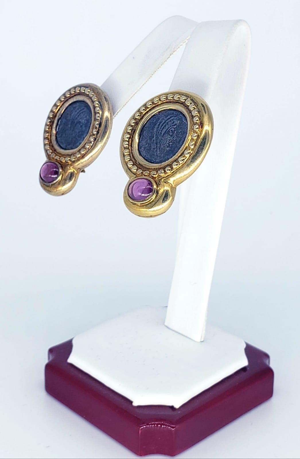 Antique Ancient Roman Coin Sapphire Cabochon Earrings. The earrings measure 24.55 X 31.14mm and approx weight 19.5 grams 14k. The earrings are bold and make a strong statement about Ancient Rome and shows signs of wear.